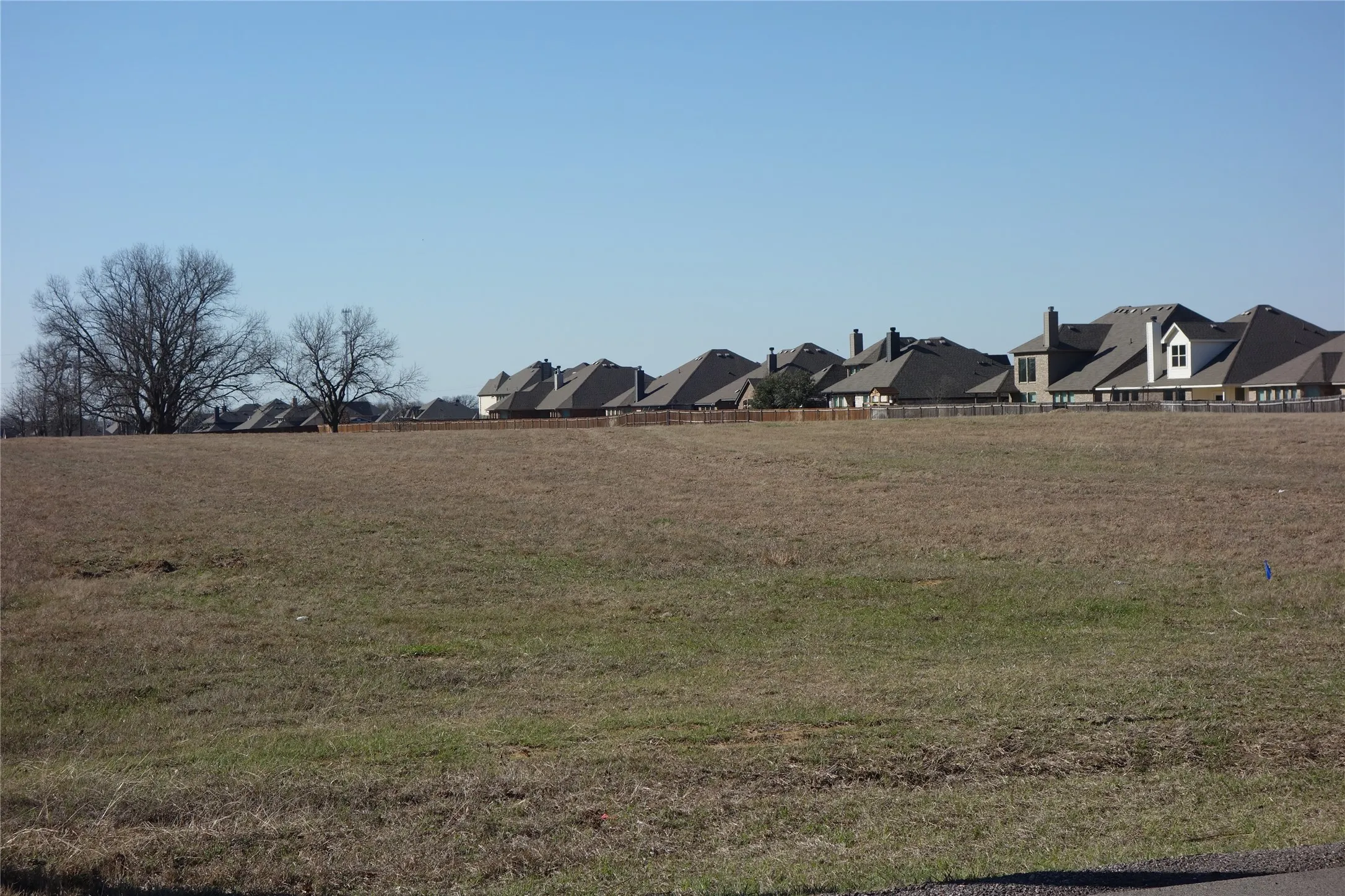 Expansive cleared lot featuring level terrain