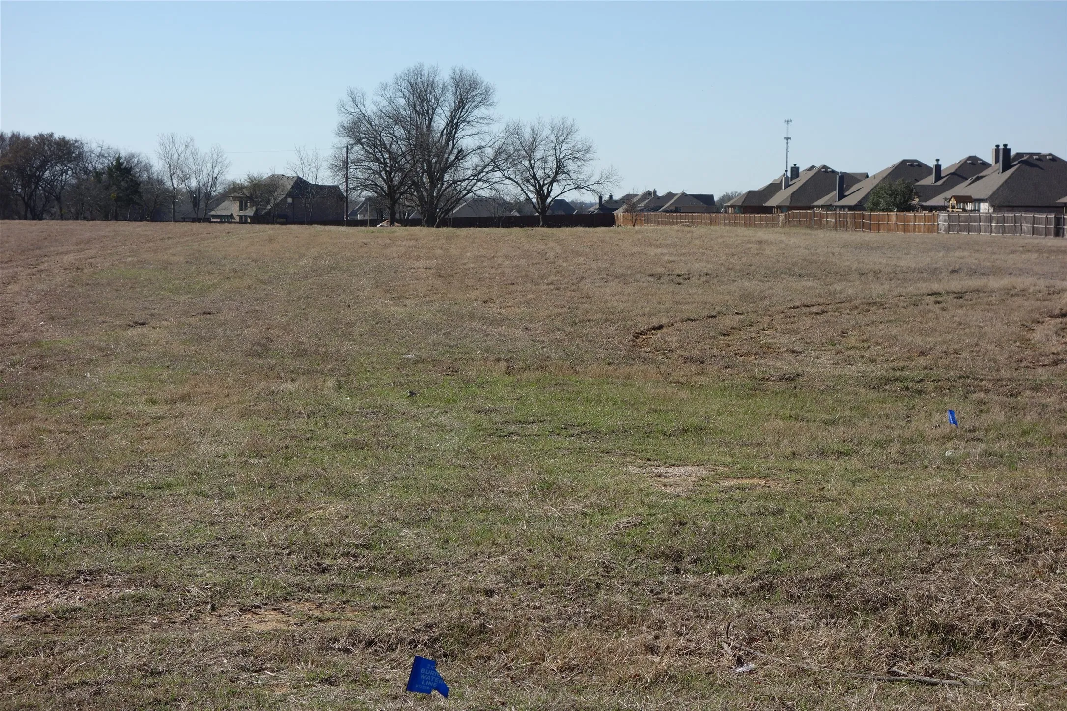 Expansive undeveloped lot featuring varied topography and natural ground cover