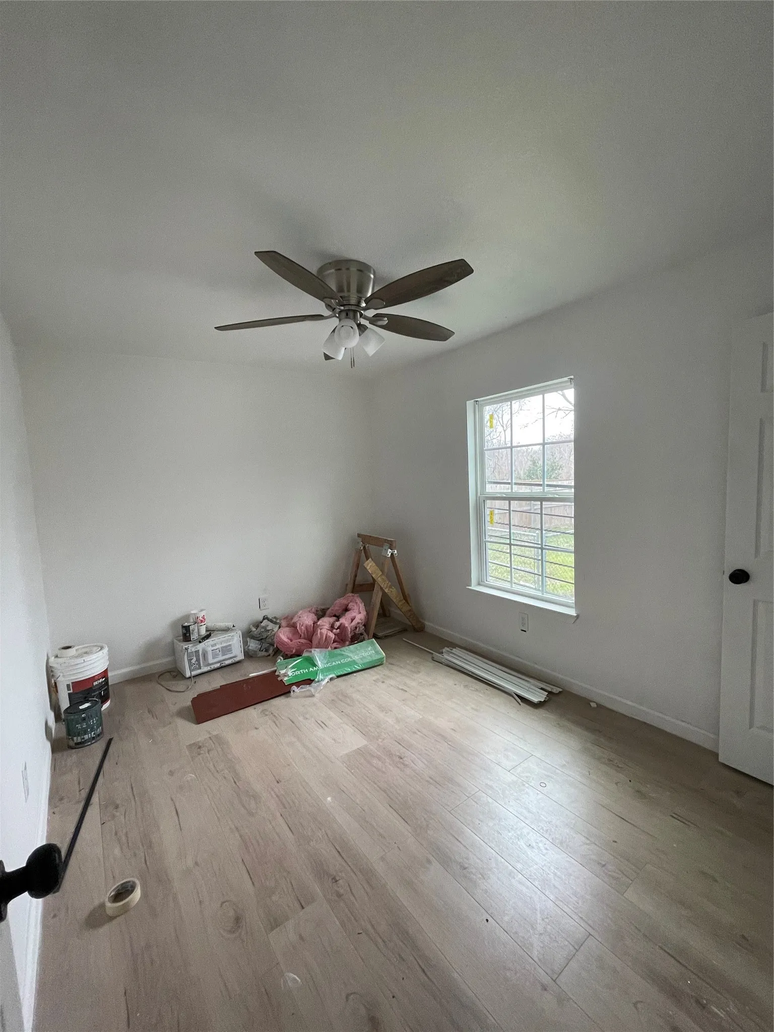 Bedroom featuring ceiling fan and light hardwood / wood-style flooring