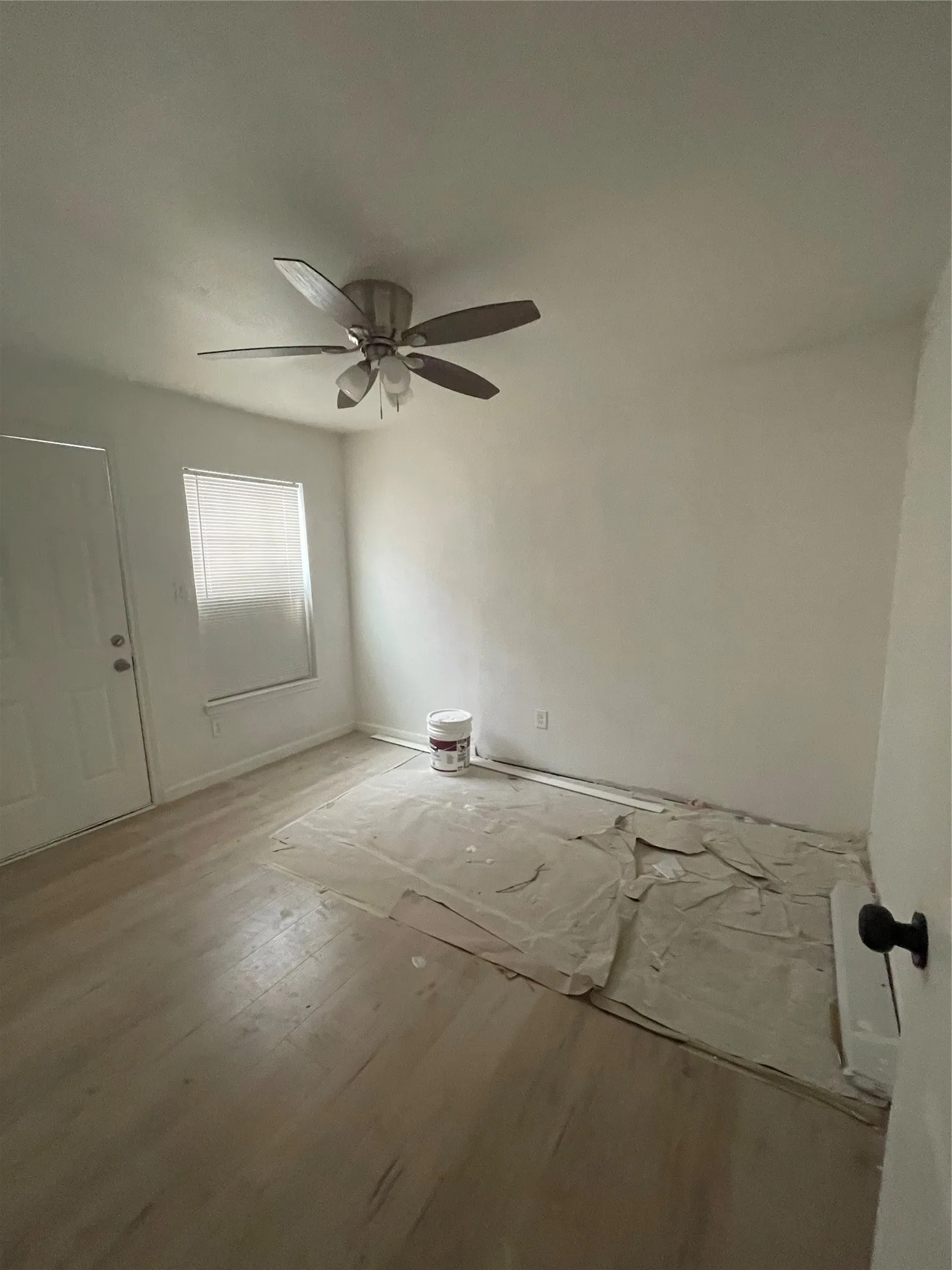Bedroom featuring ceiling fan and light hardwood / wood-style flooring