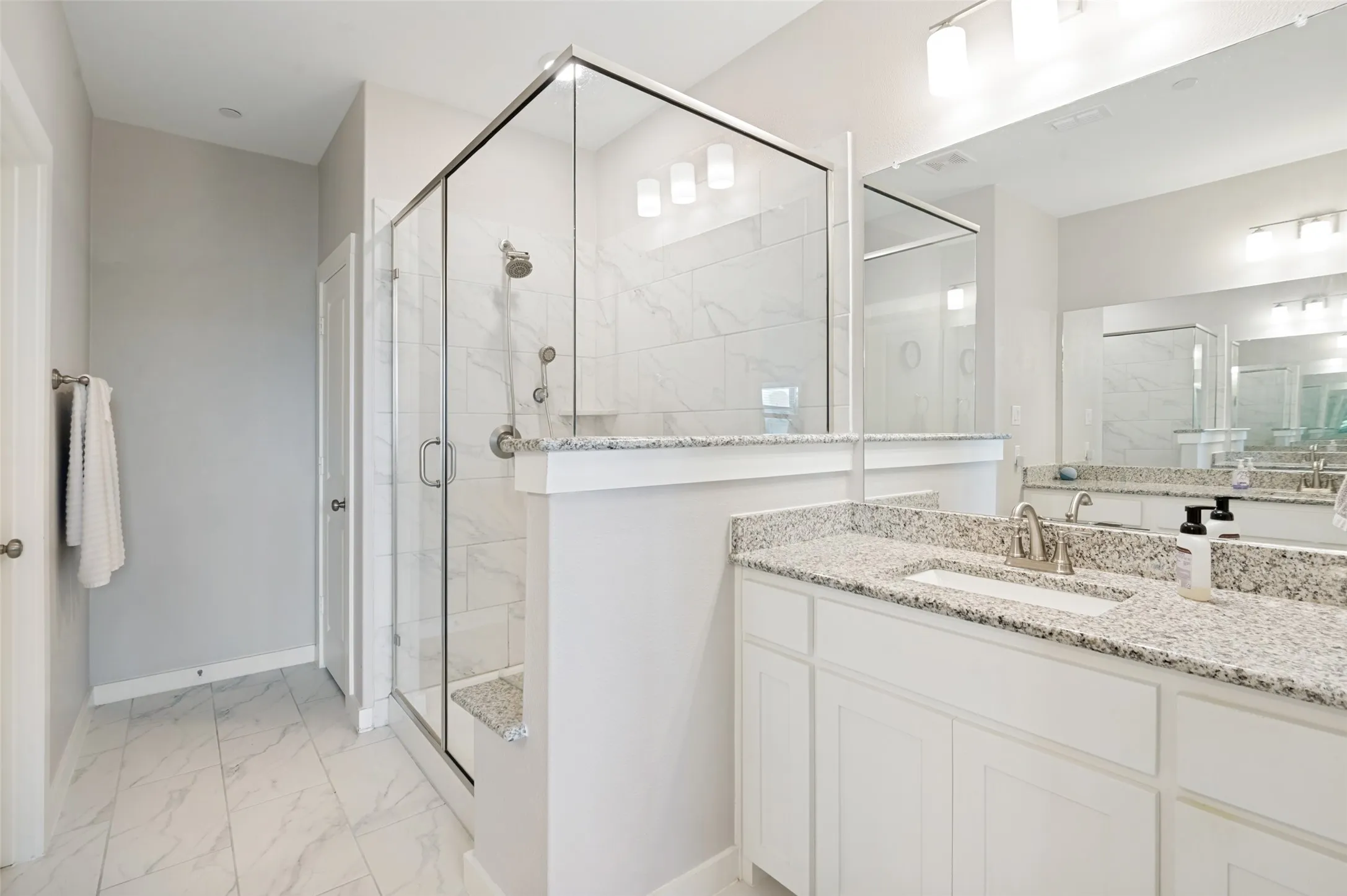 En suite with primary bedroom