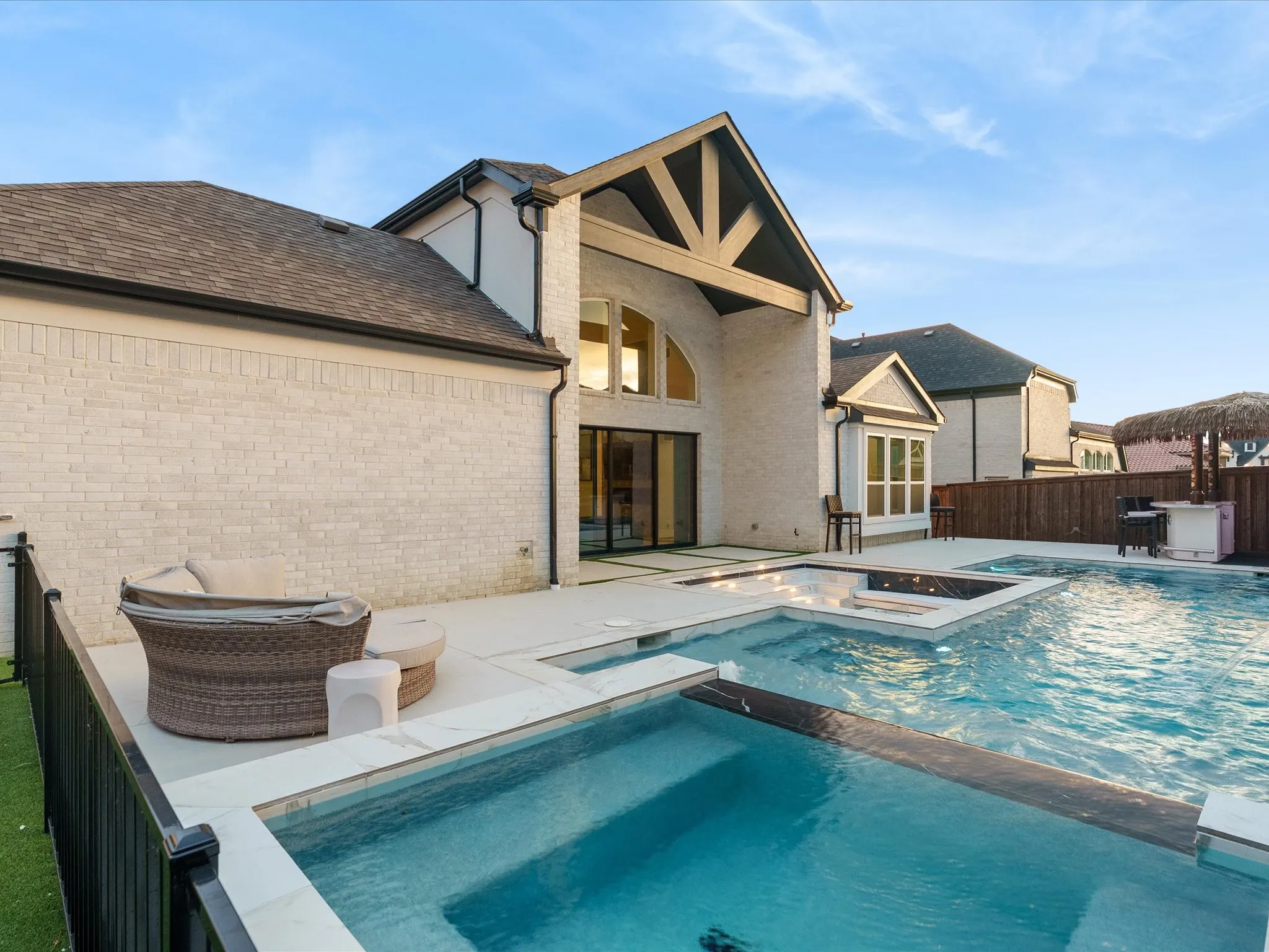 Custom pool featuring multiple levels and an integrated spa