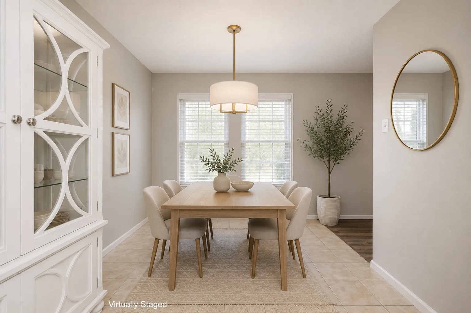 Dining area featuring a contemporary chandelier, two large windows with blinds, and light-toned wall paint