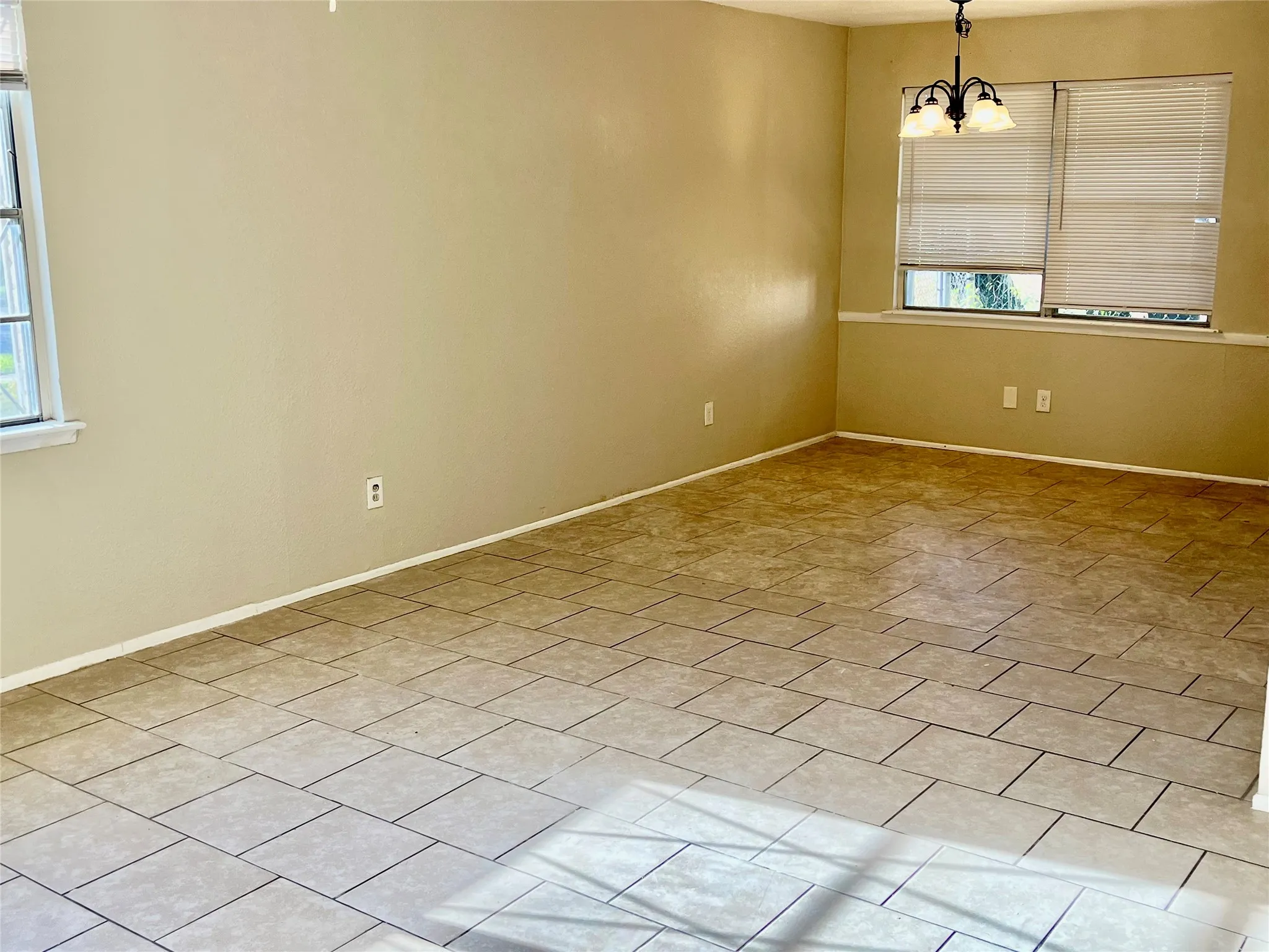 Neutral-toned walls complement the tile flooring