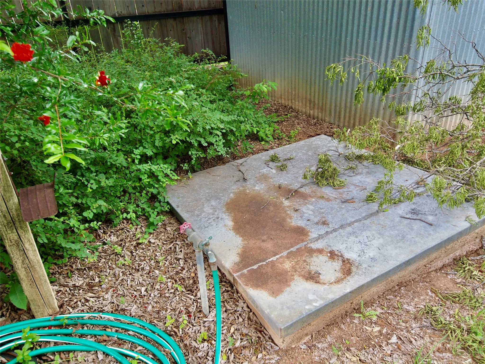 Water well underneath metal lid
