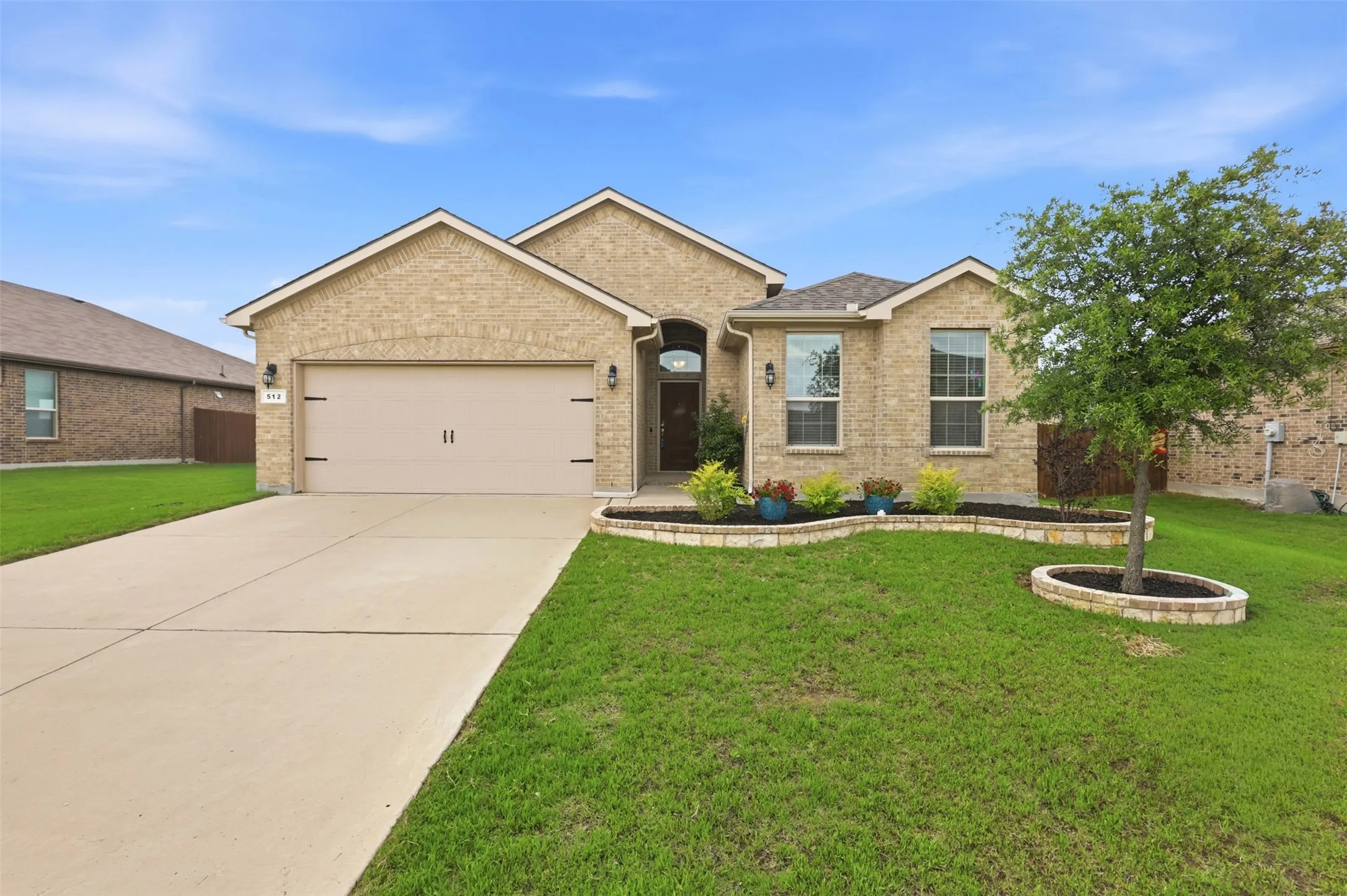 Brick exterior with a two-car garage