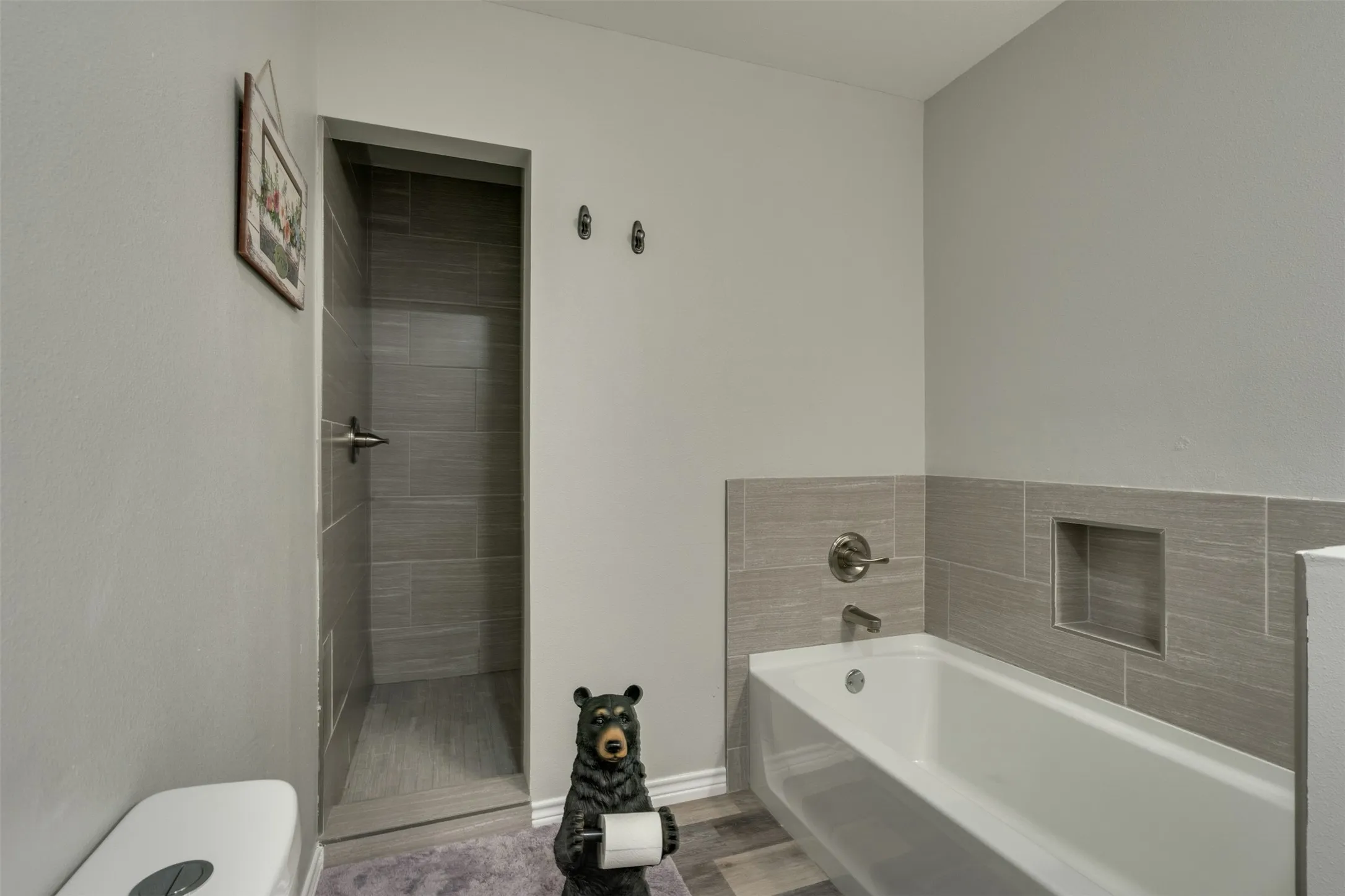 Large soaking bathtub with separate walk in shower.