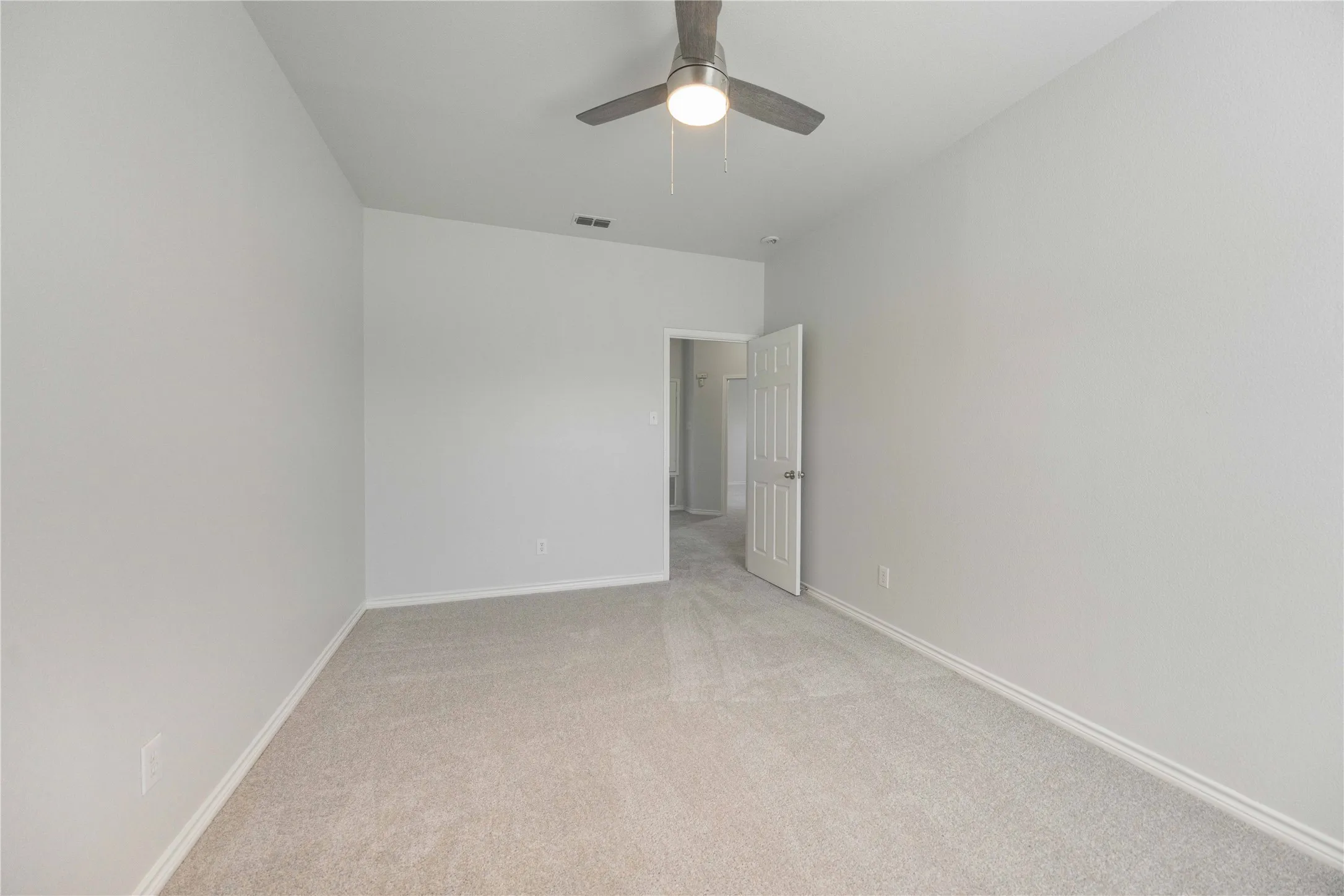 Neutral-toned wall paint and carpeting throughout