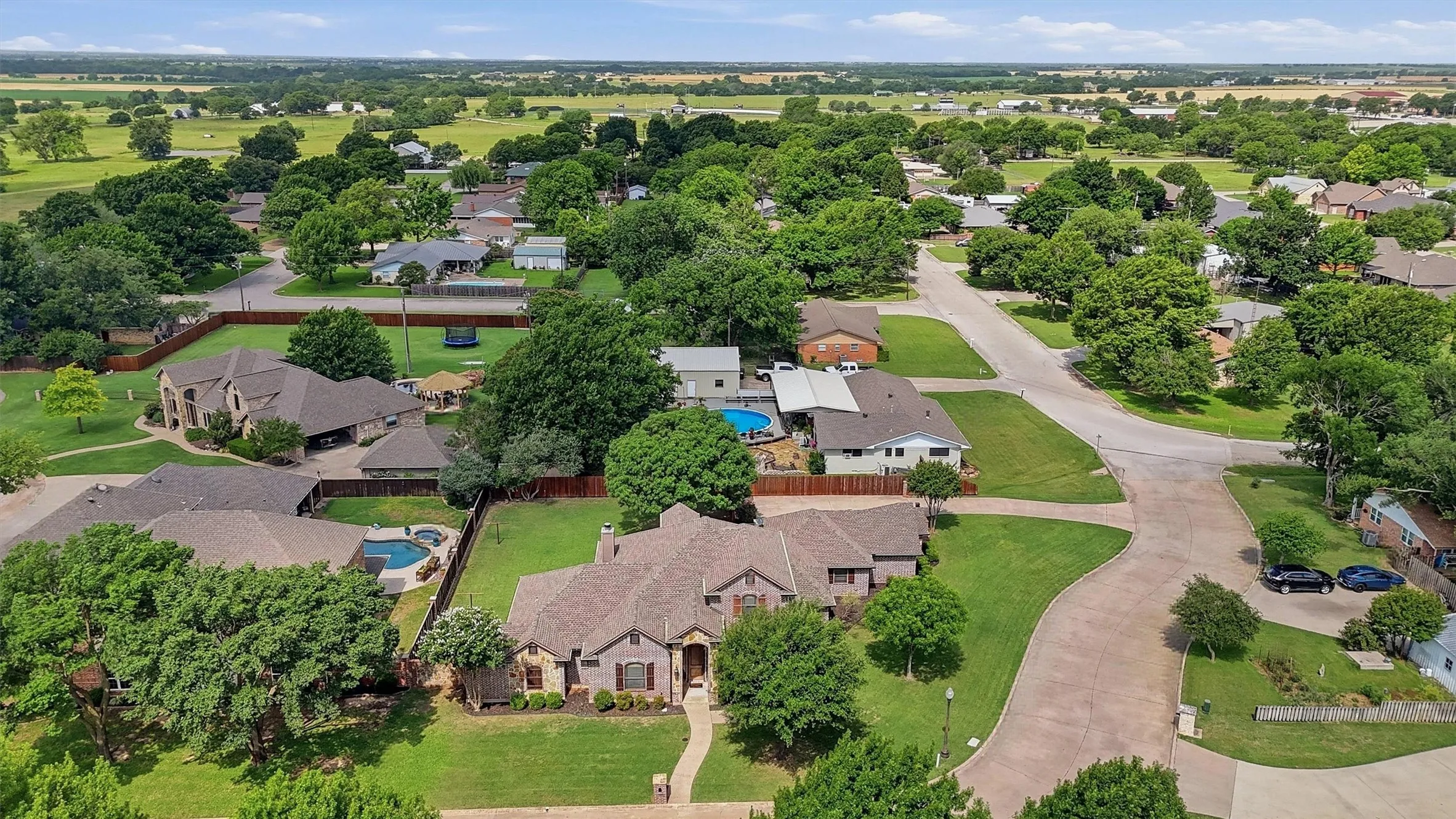 Residential neighborhood featuring mature trees and established homes