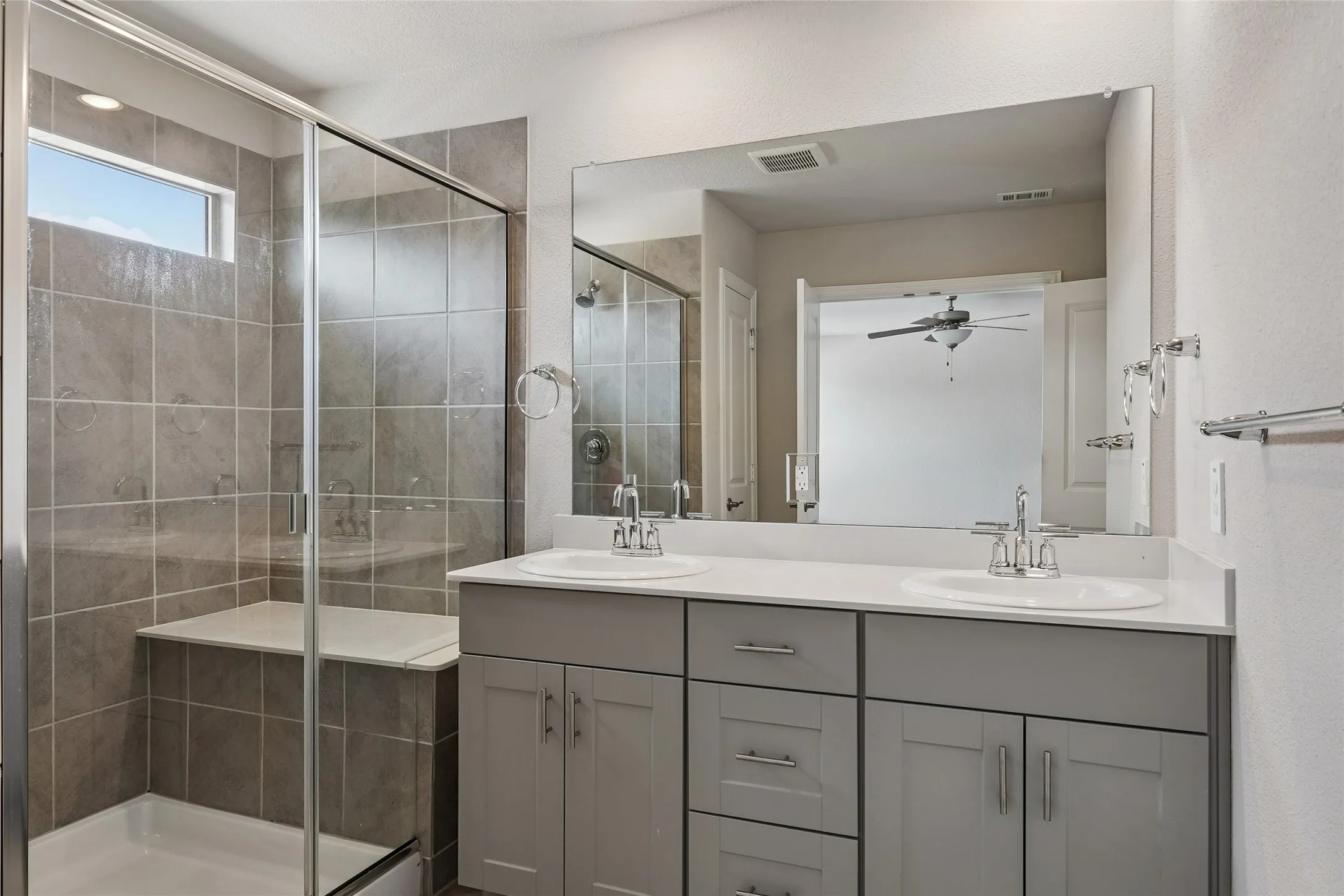 Primary bath with dual sinks and spacious shower