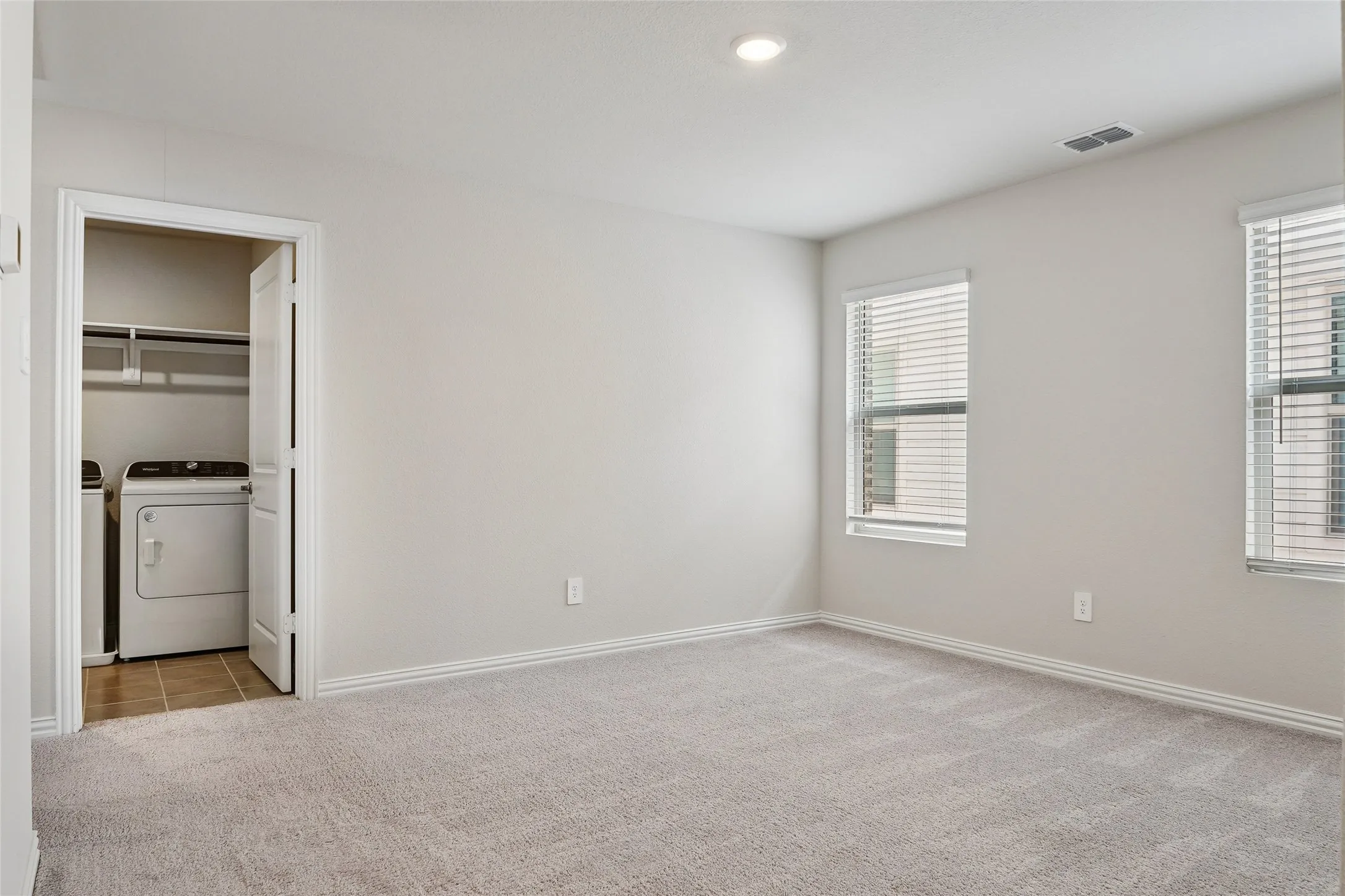 Laundry room located upstairs off the loft area