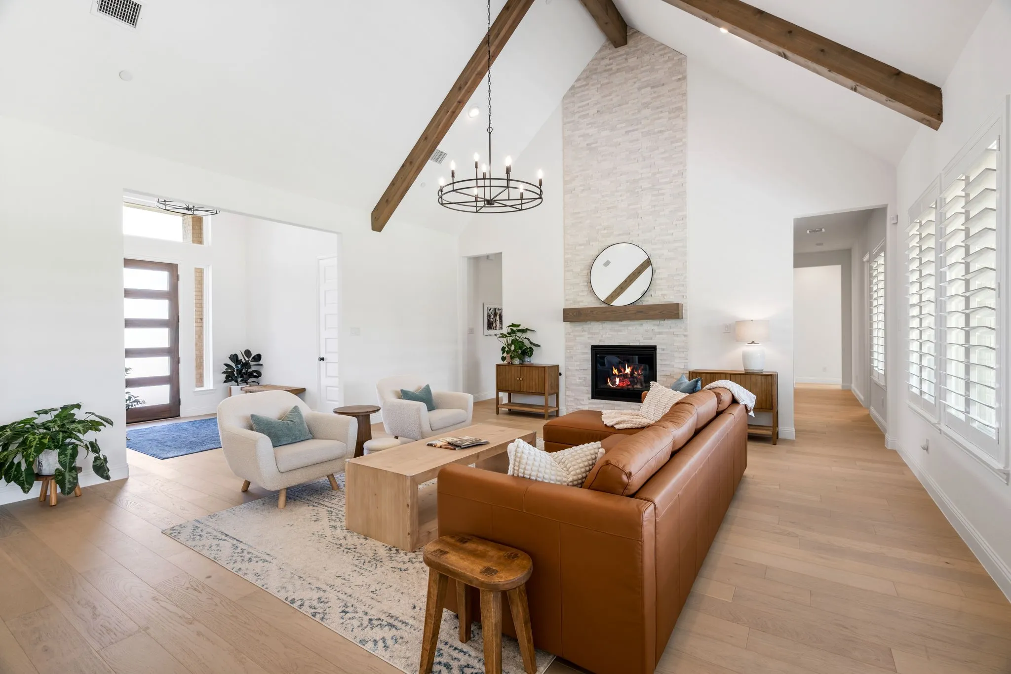 Beyond the fireplace, twin entryways lead into the game room.
