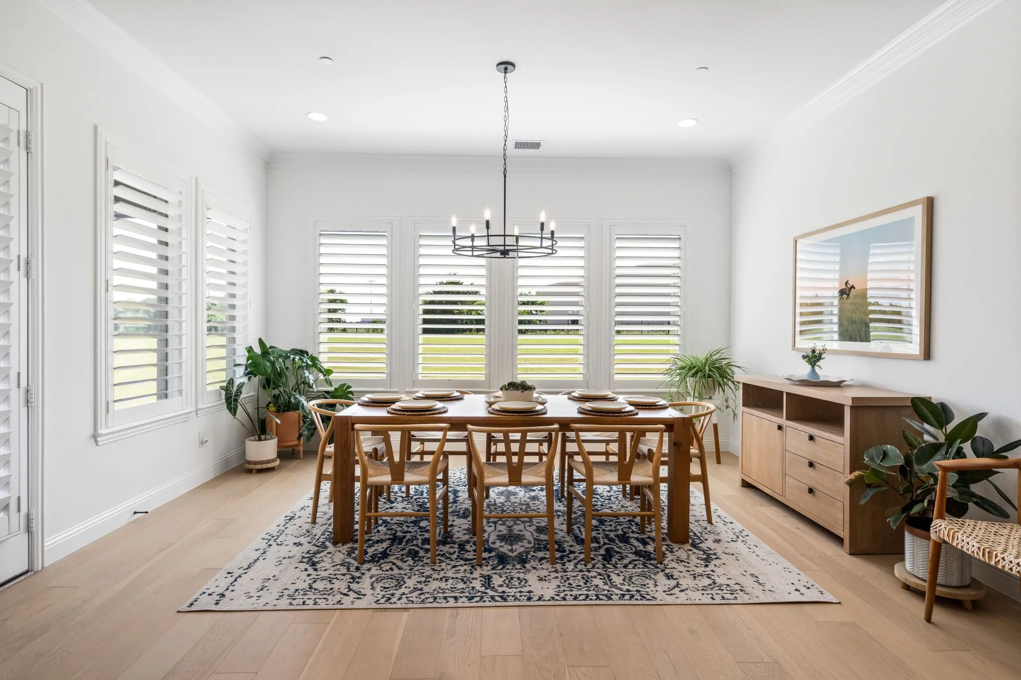 Oversized, sun-drenched breakfast room perfect for casual dining.

