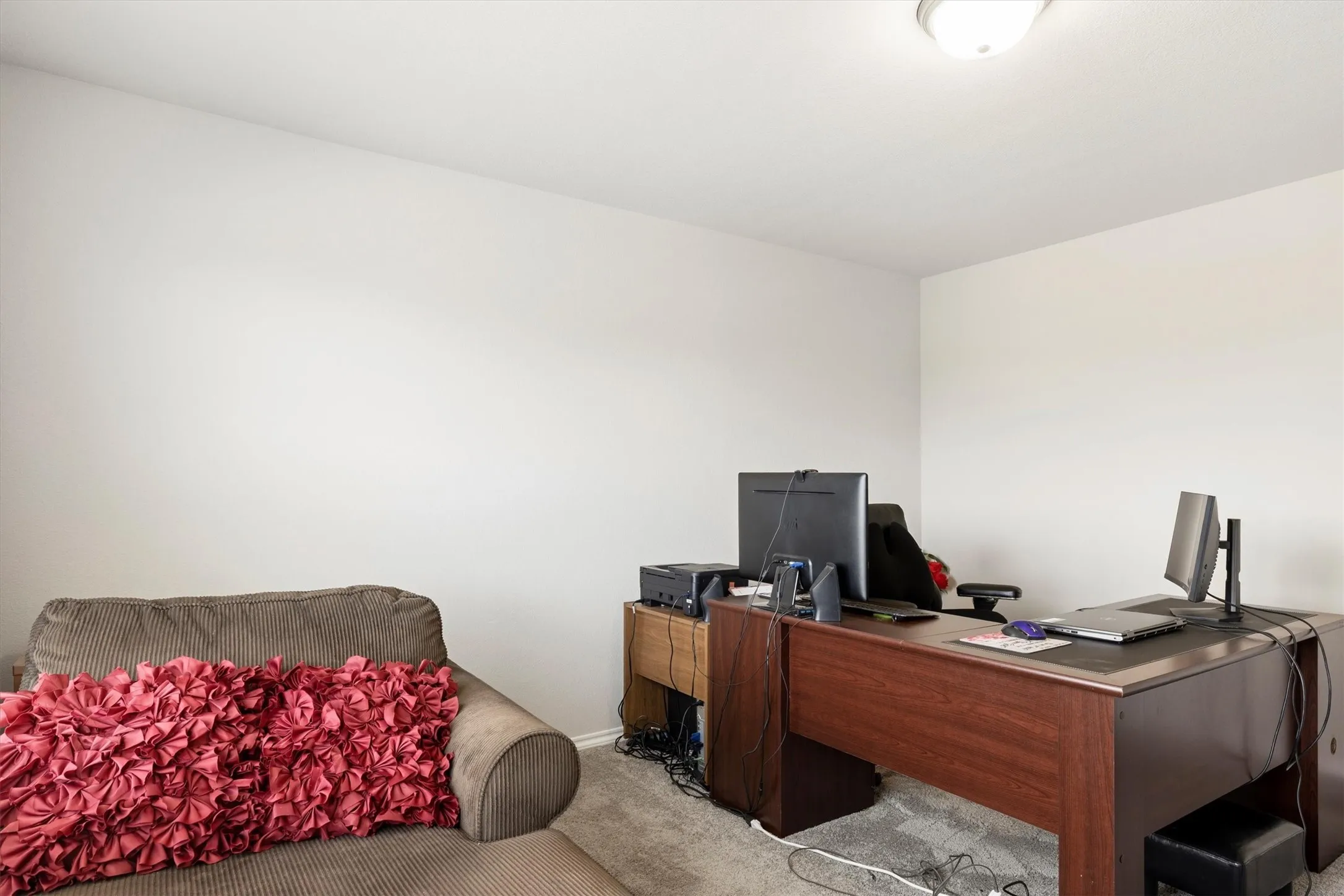 Room featuring light gray carpet, neutral wall paint, and a semi-flush mount ceiling light