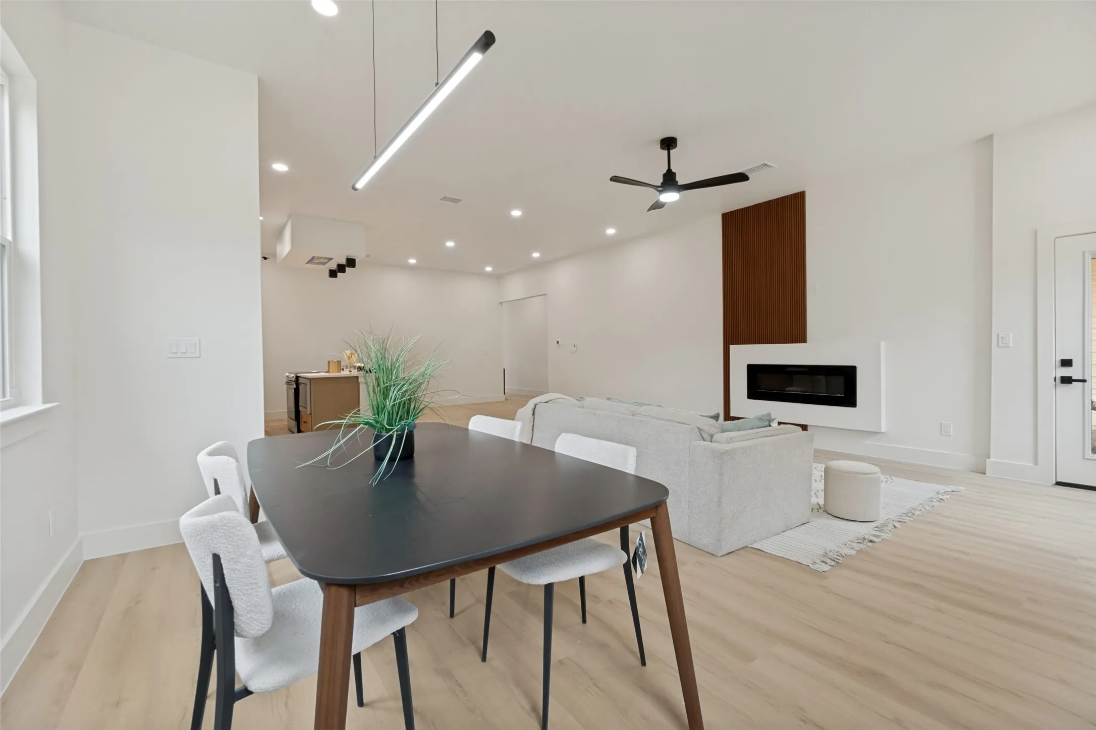 Open-concept living space featuring light wood-finish flooring throughout