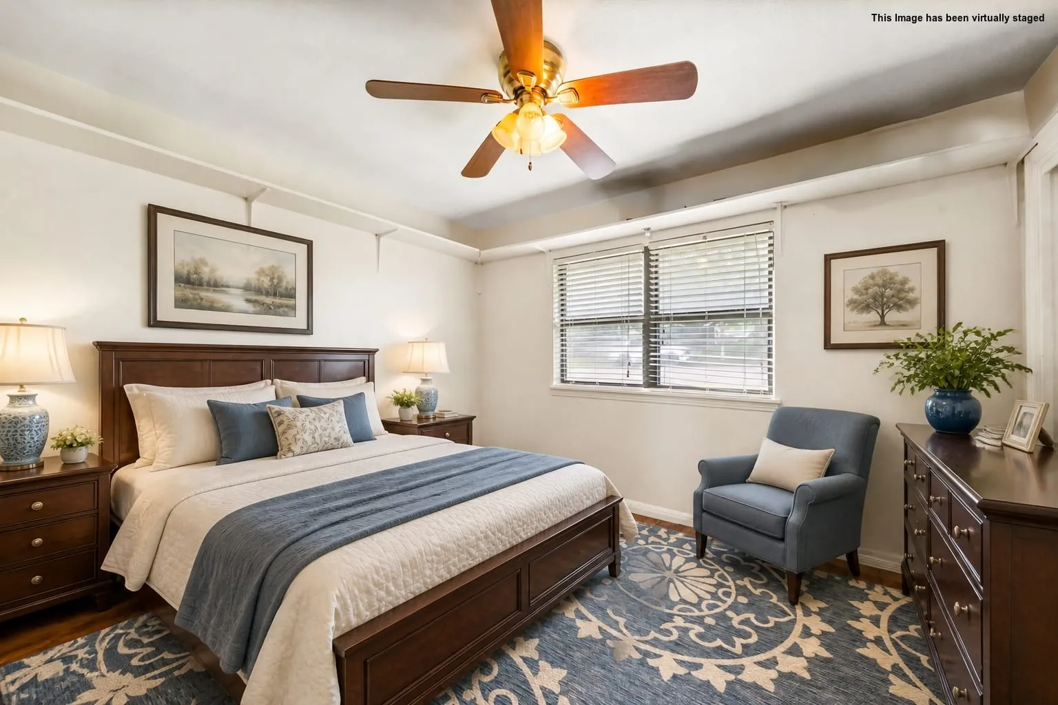 Wood-finish flooring, ceiling fan with integrated lighting, window with blinds, and recessed ceiling details