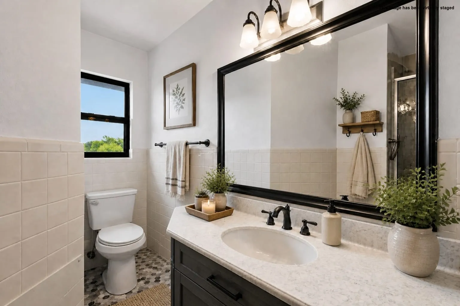 Vanity with an integrated sink and countertop, dark wood-finish cabinetry, and a large framed mirror