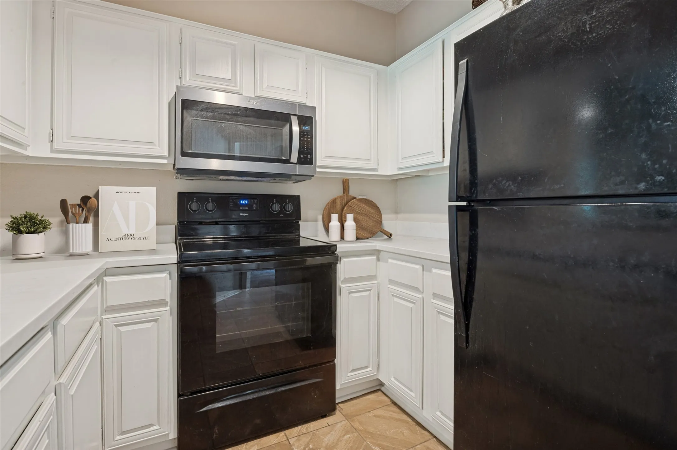 Kitchen was recently updated with quartz countertops, fresh paint and  a new stainless steel microwave