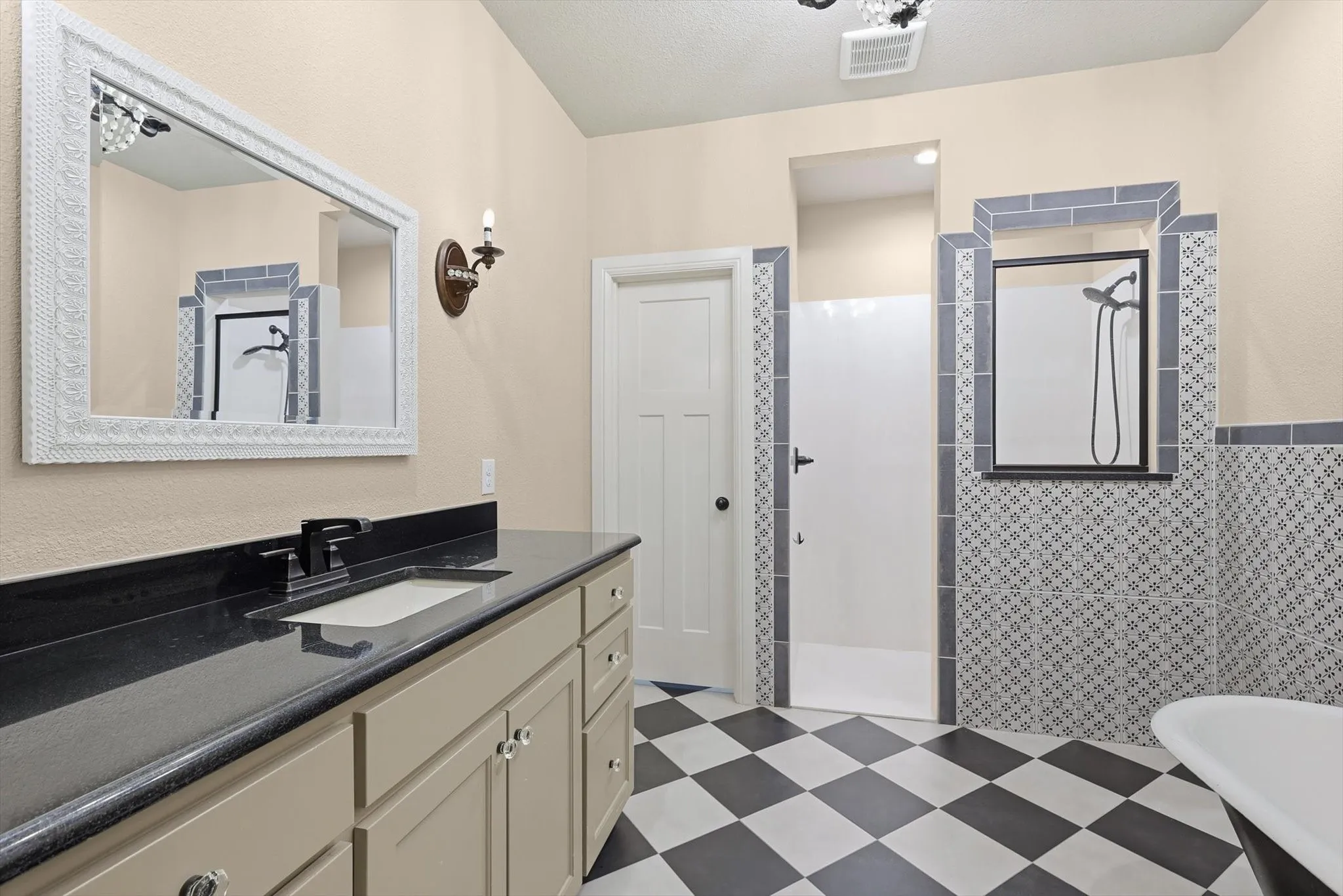 Vanity with rectangular undermount sink and dark countertop