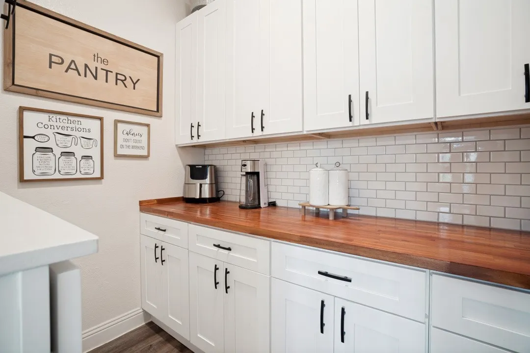Walk-in pantry with extra storage on left side,