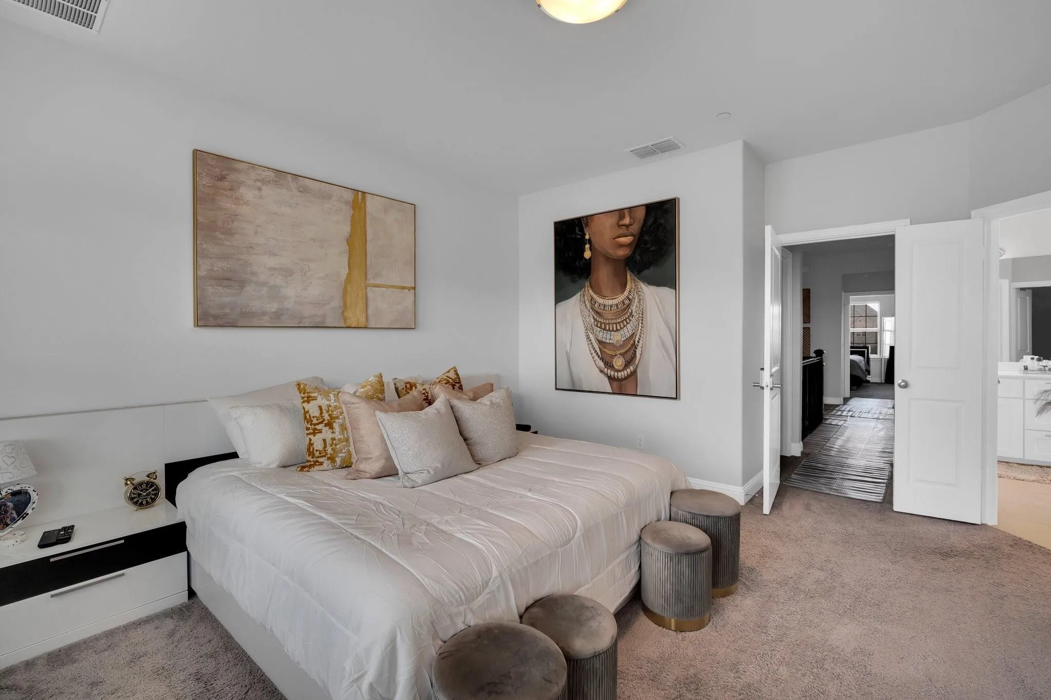 Carpeted bedroom featuring white walls and a ceiling-mounted light fixture
