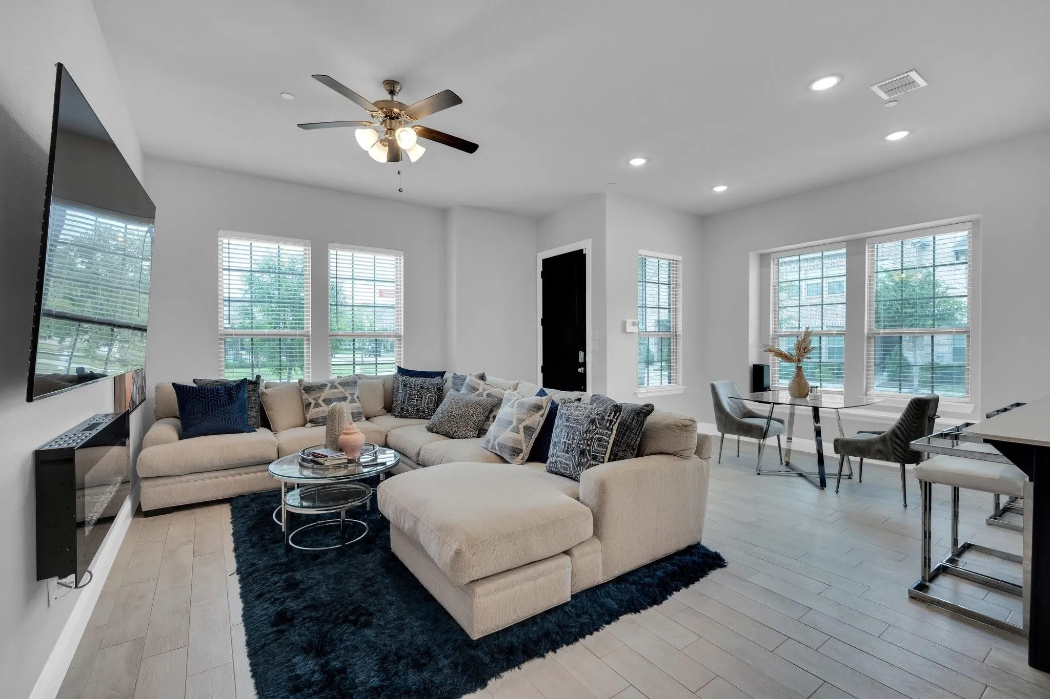 Open-concept living area featuring light wood-finish flooring throughout