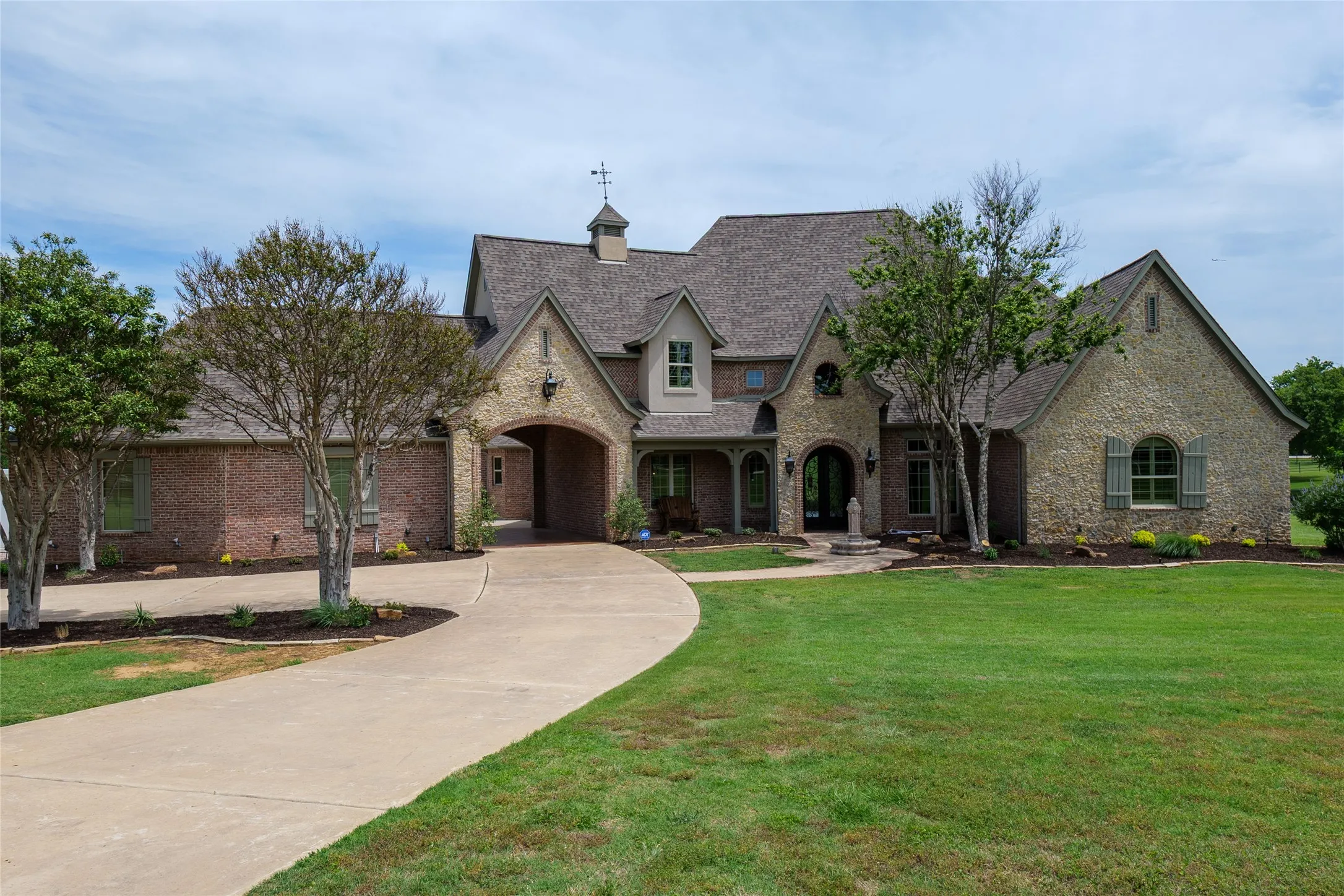 View of the home as you enter the front gate