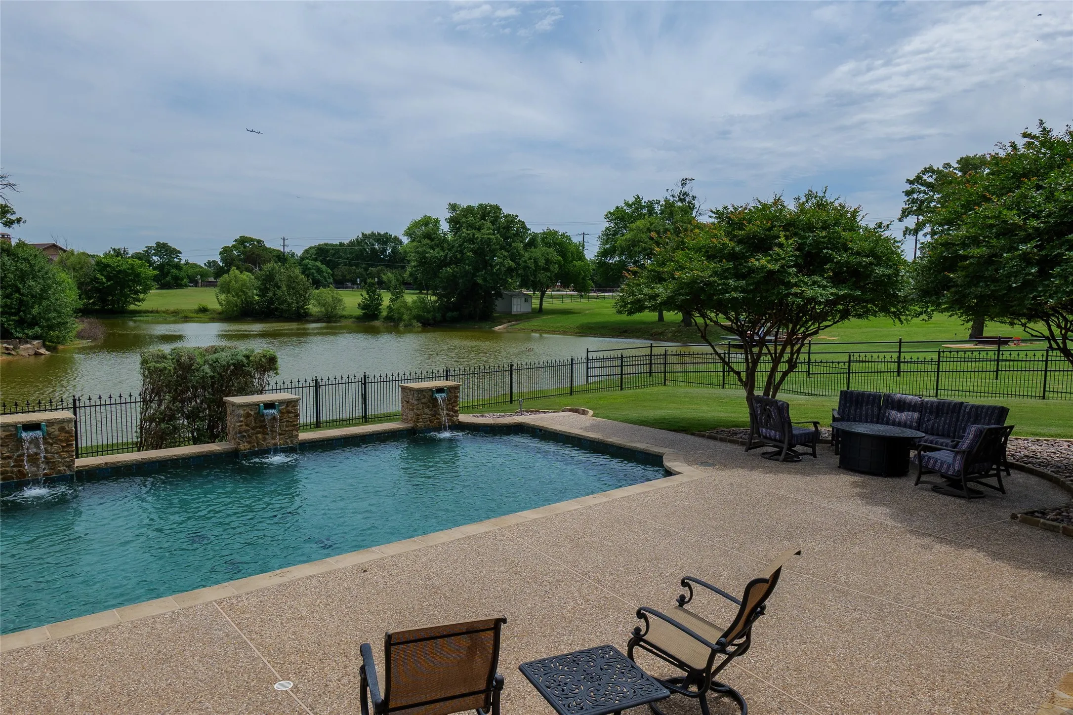 Another view of pond and pool from the covered patio