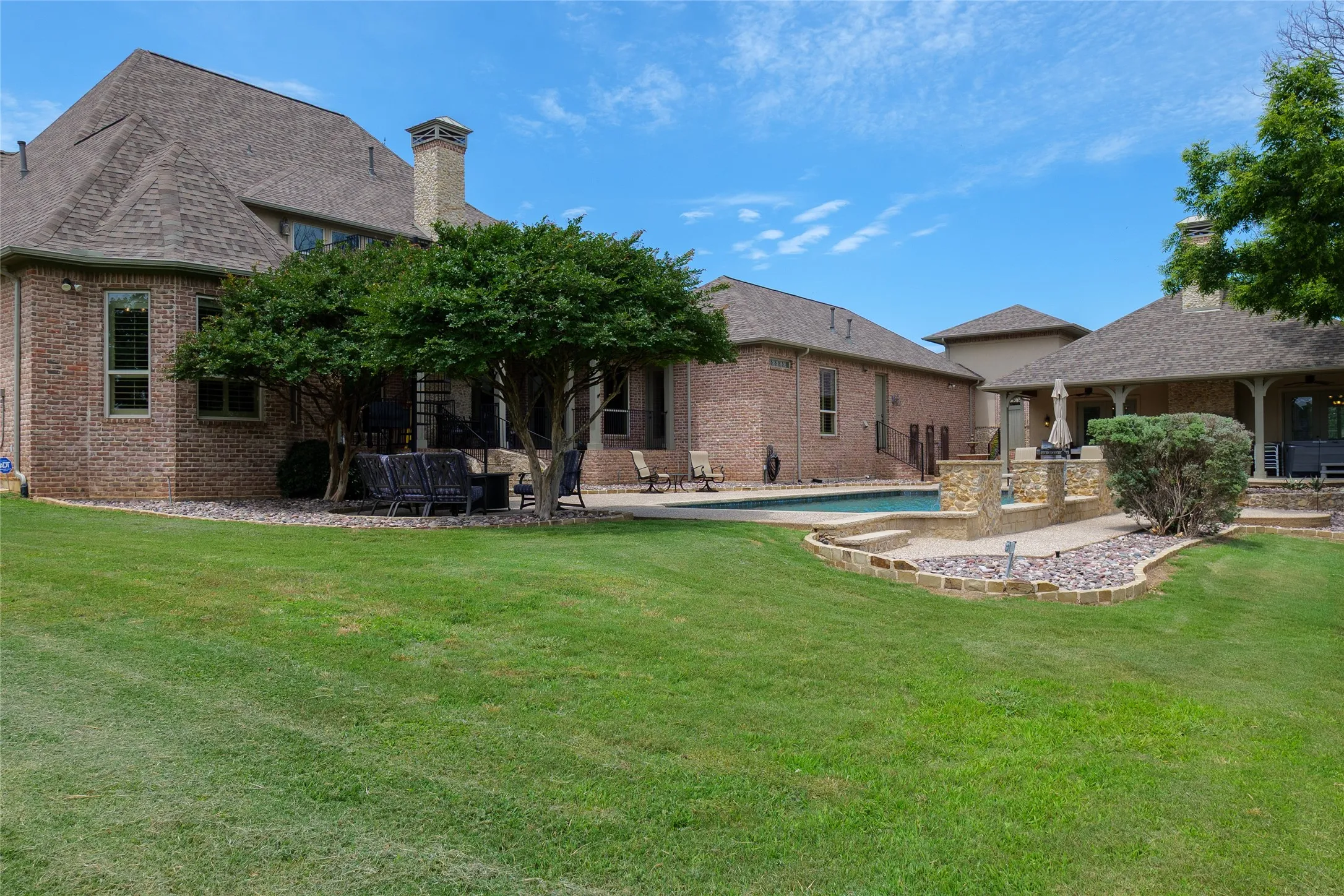 Back side of the house looking back from the corner of the acreage