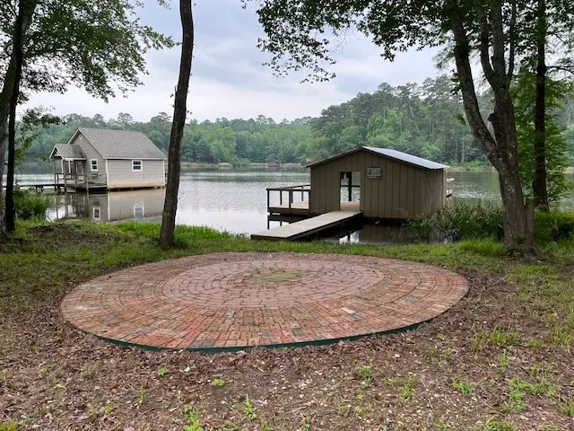 BOAT HOUSE, OPEN BRICK PATIO AND FIRE PIT AREA