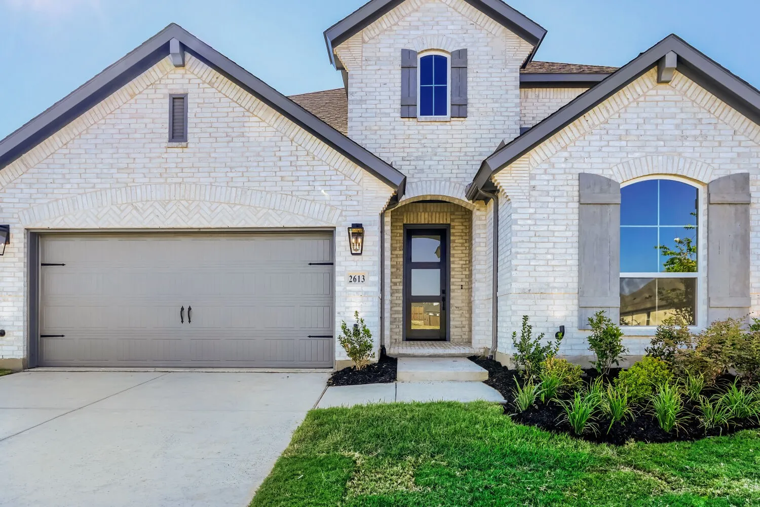 White brick exterior with dark trim accents