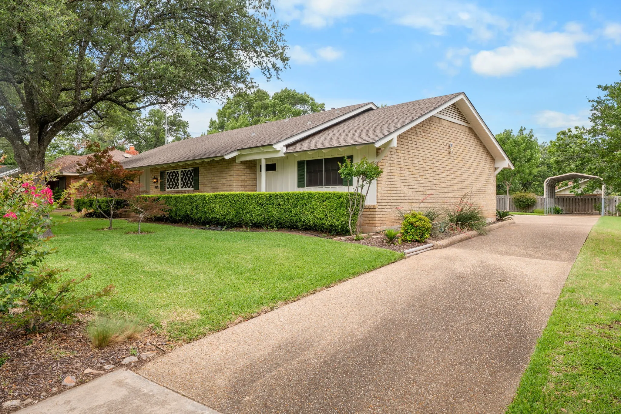 Brick exterior featuring a gabled roofline