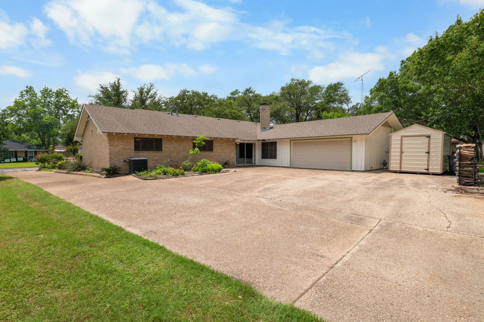 Expansive concrete driveway offering generous parking