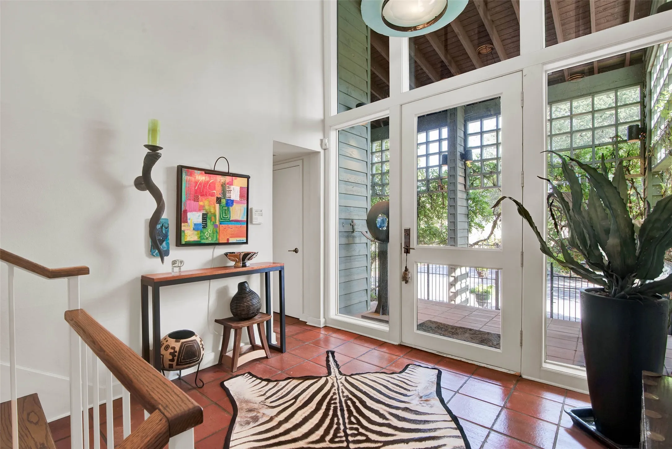 View of front door from interior of home.