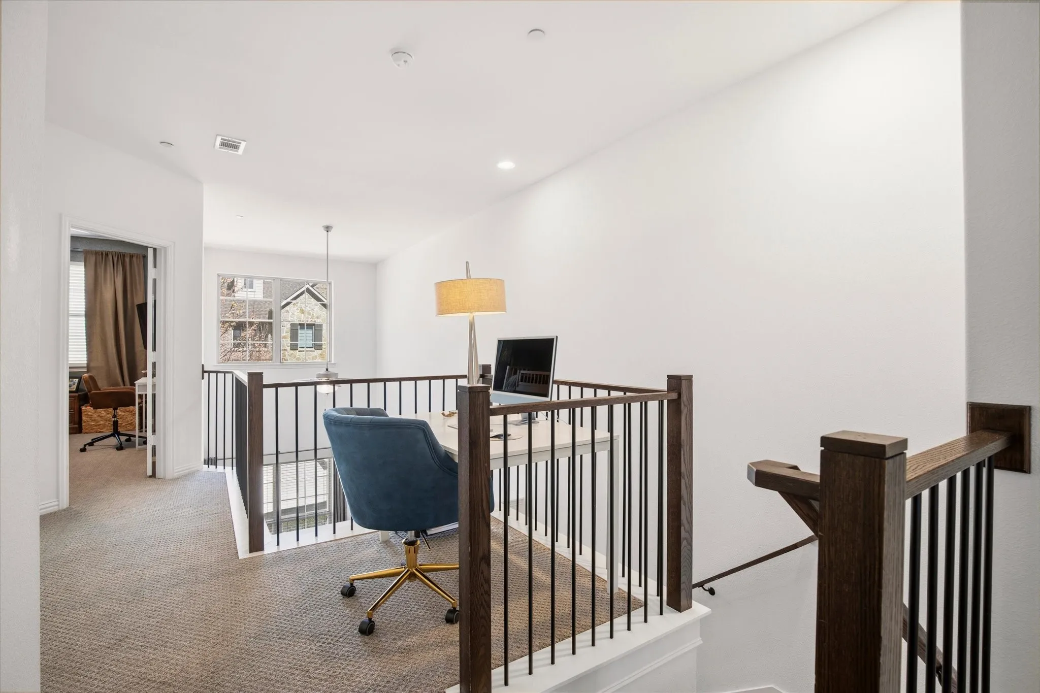 At the top of the stairs, there is a nook that can be utilized for a study or work space.