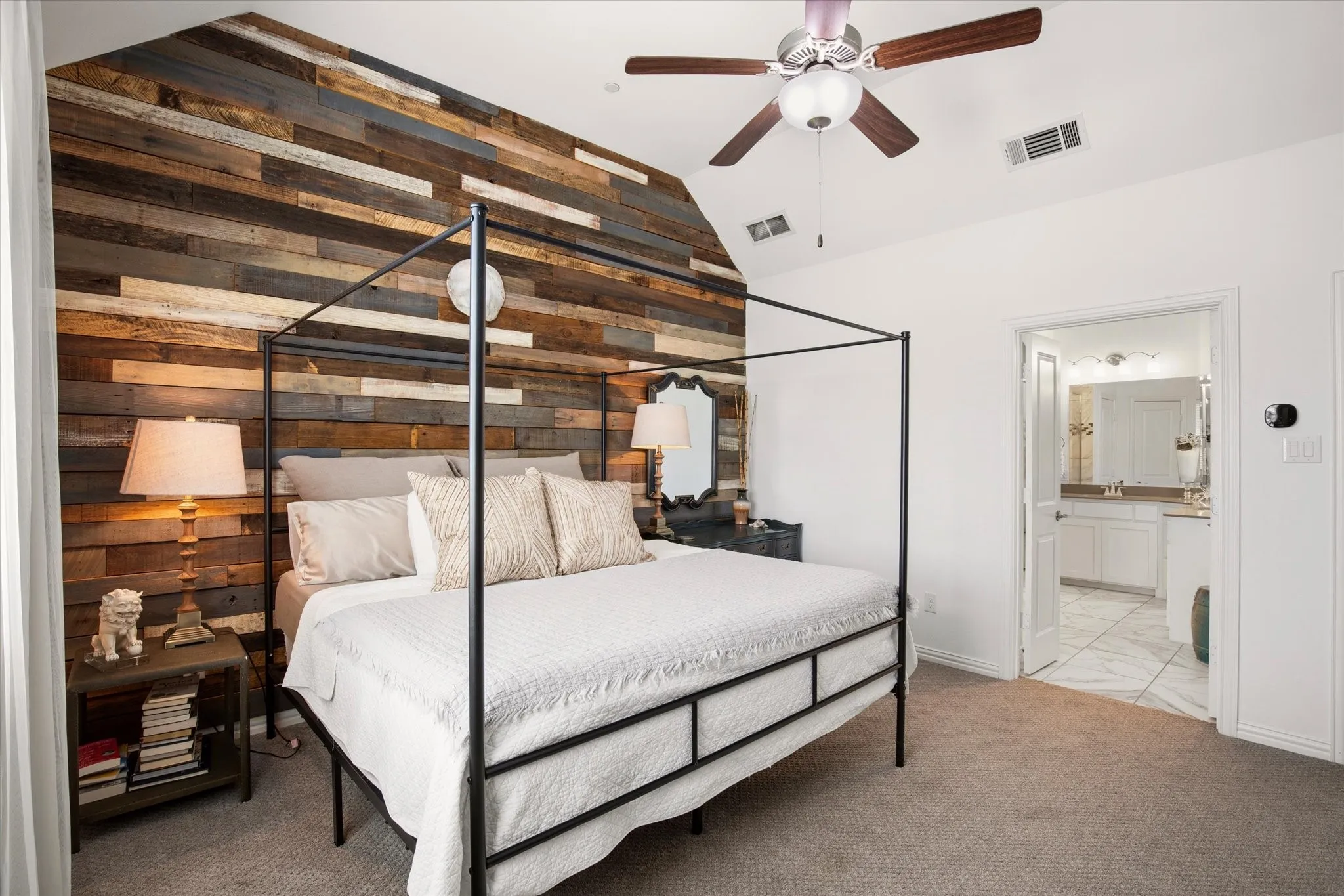 The accent wall theme is continued into the primary bedroom.