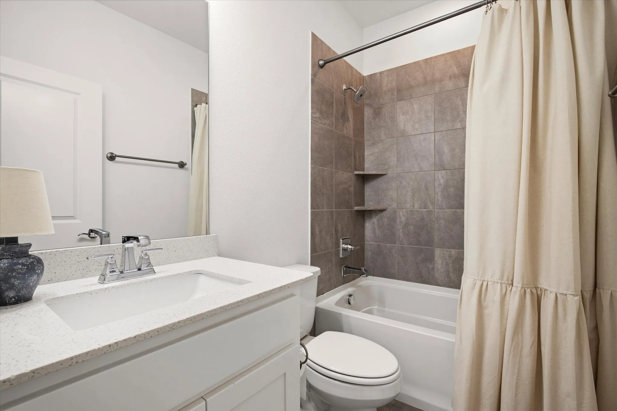 The guest bathroom is just outside the guest bedroom.