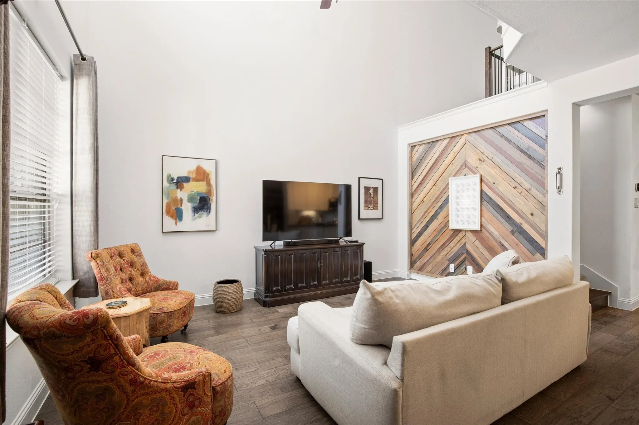 The accent wall creates a focal point for the room's decor.