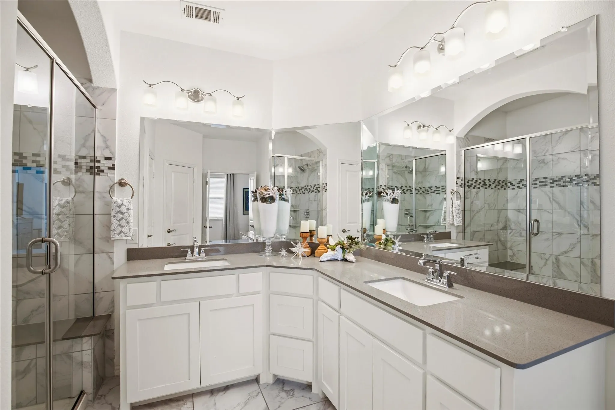 Mirrors and light make this primary bath special.