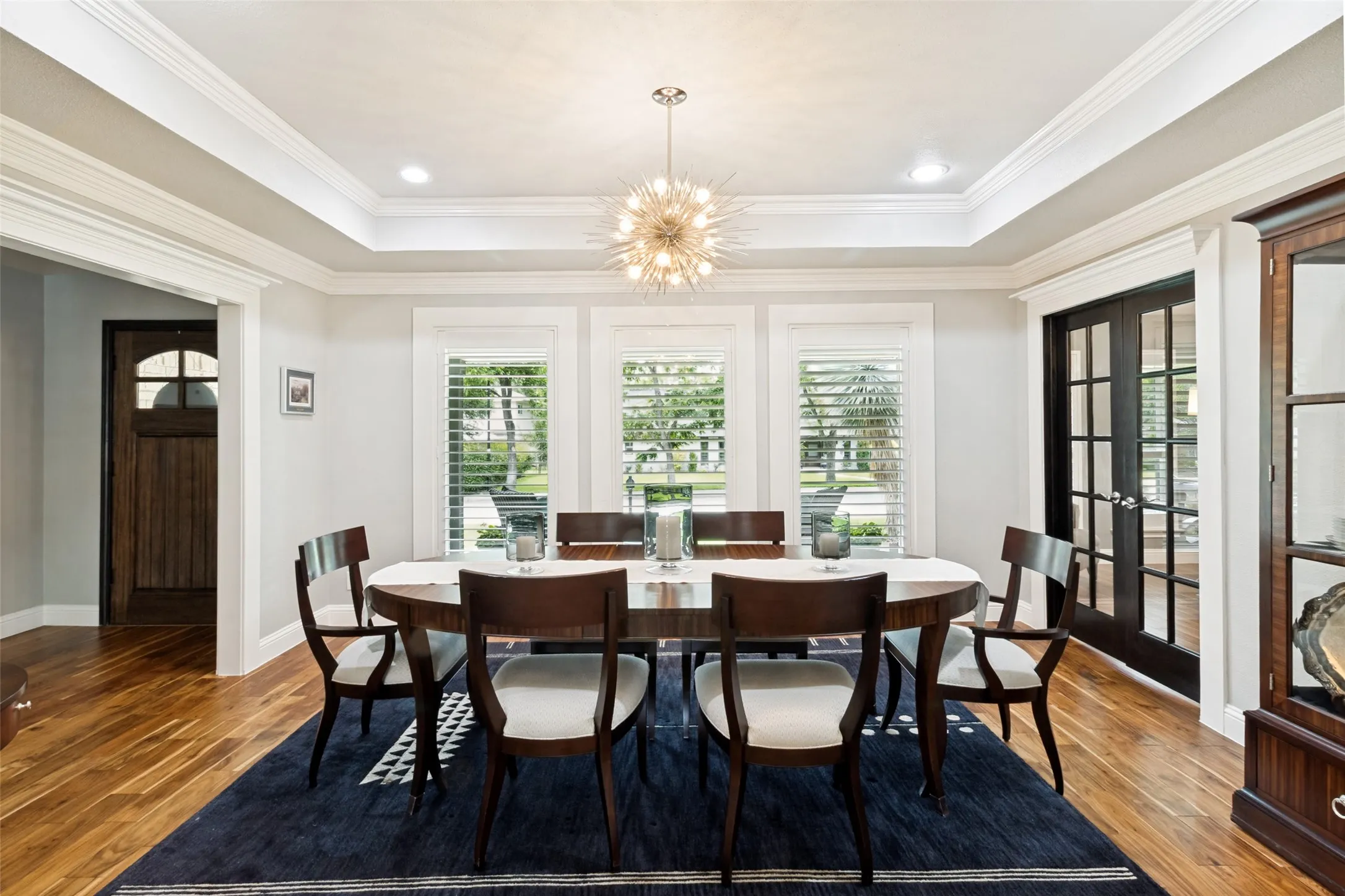 The entry leads to beautiful wood floors throughout the main living area and formal dining room.
