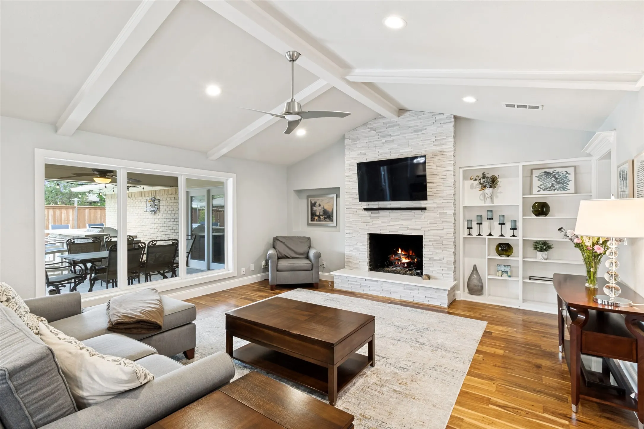 Remodeled stacked stone fireplace, gas logs, beautiful built ins highlight the spacious family room which overlooks the patio and pool.