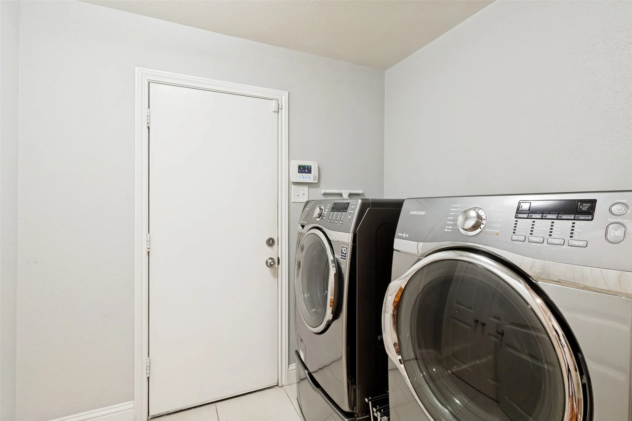 Laundry room has washer and dry hook up, great storage closet.