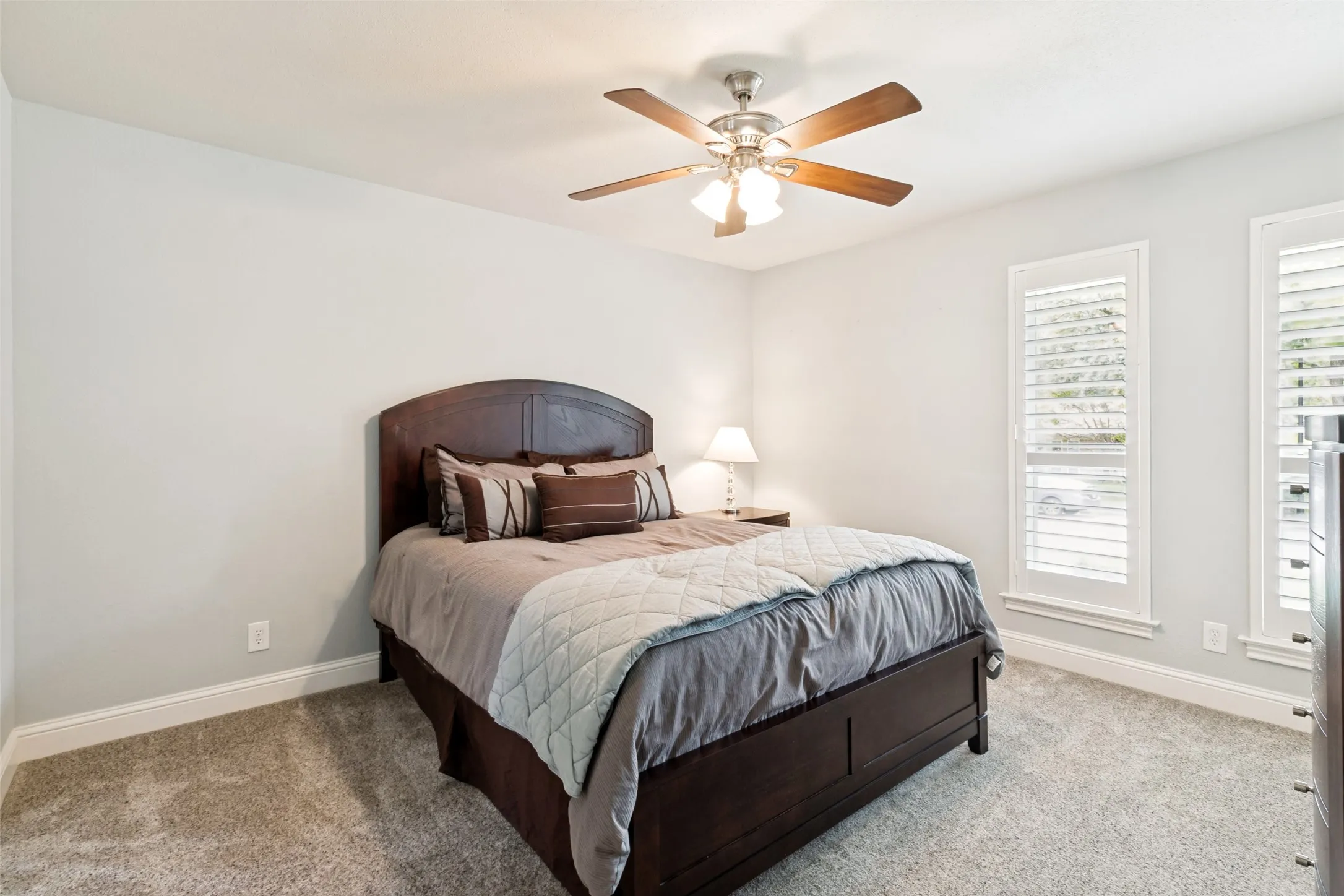 Secondary bedroom with walk in closet and ensuite Jack and Jill bath.