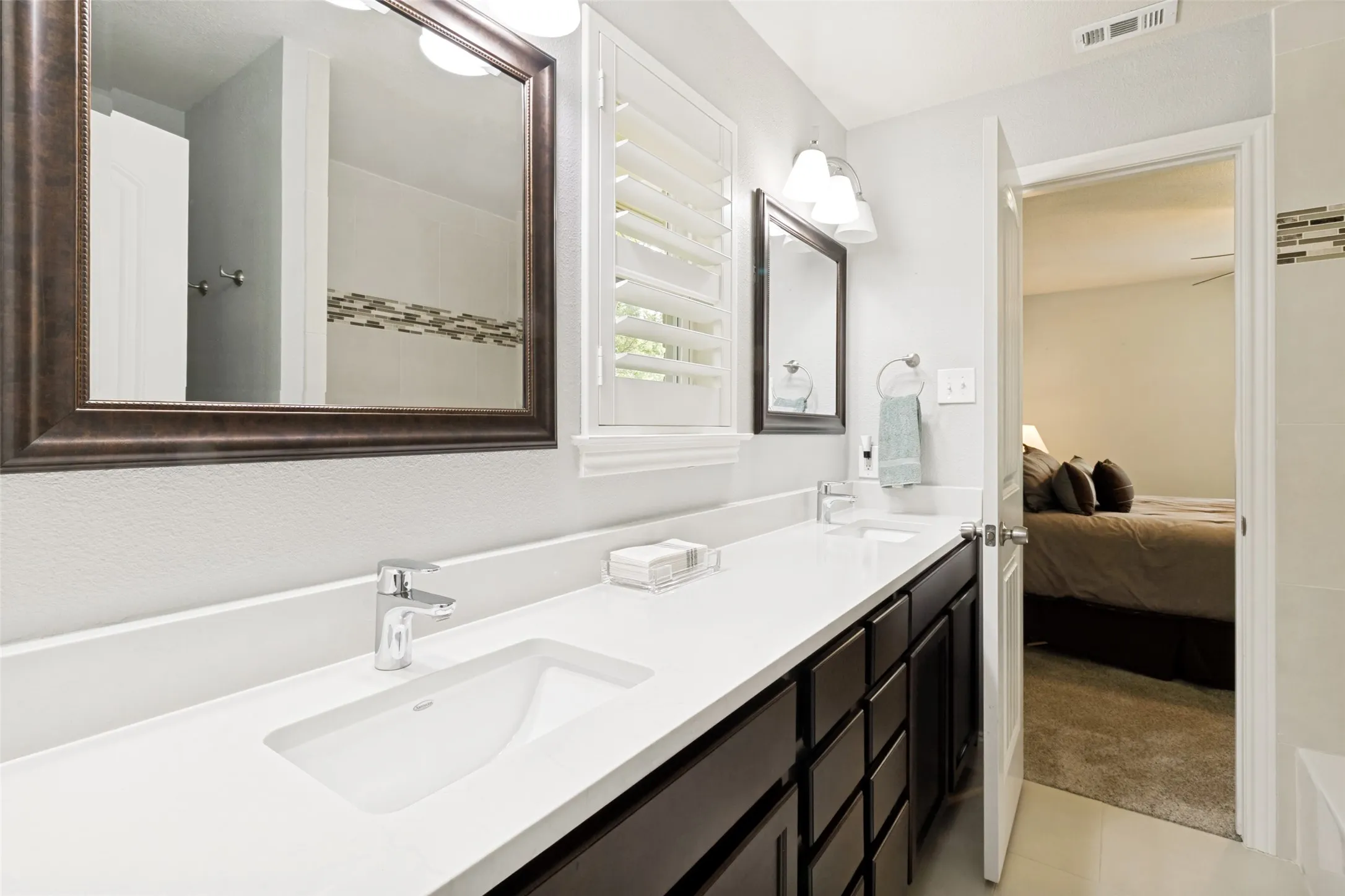 Jack and Jill bath adjoining two secondary bedrooms.