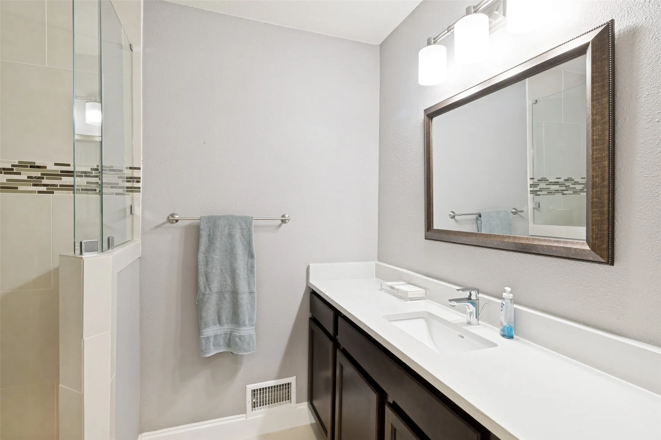 Full bath adjacent to fourth bedroom.