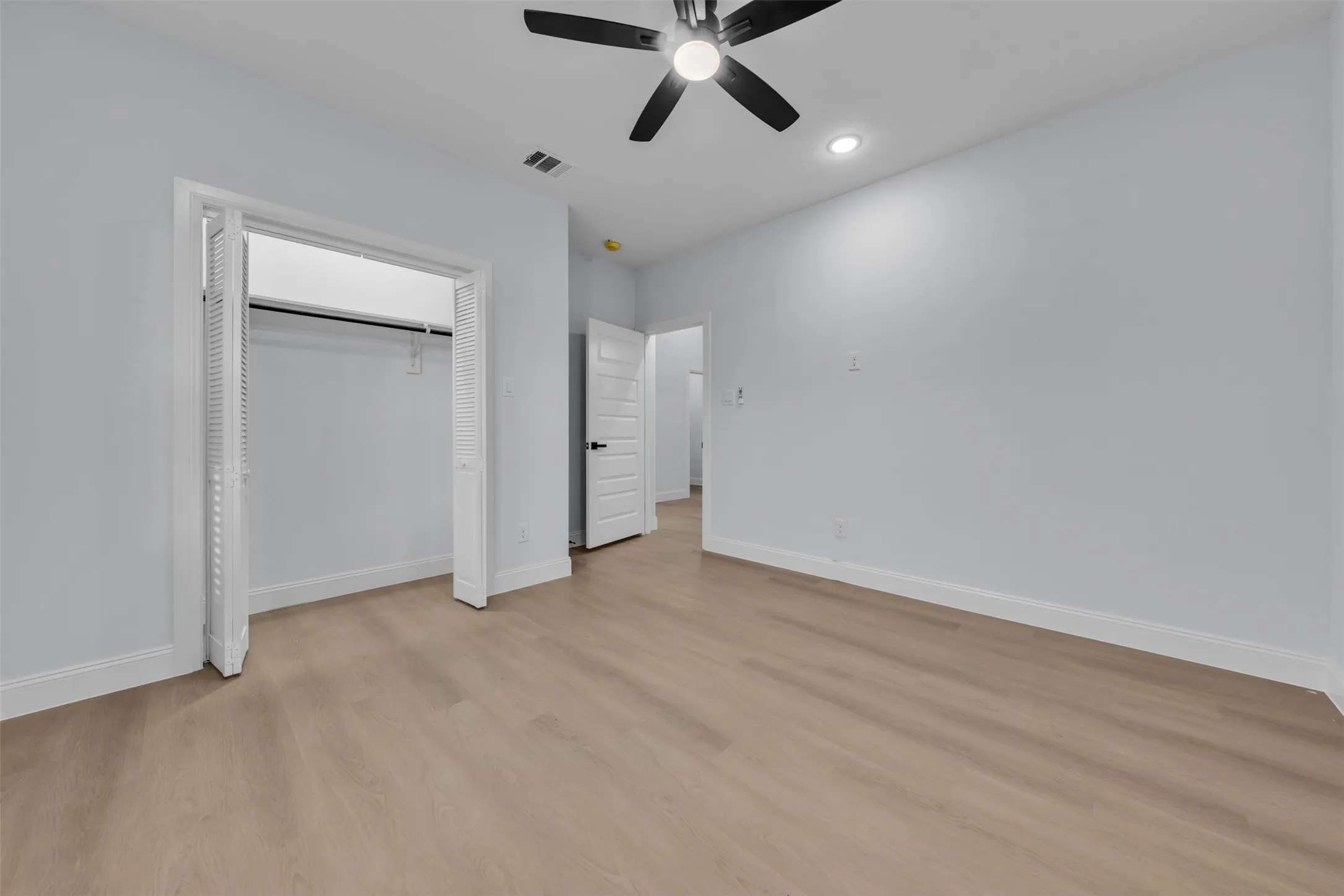 Neutral paint tones with wood-finish flooring