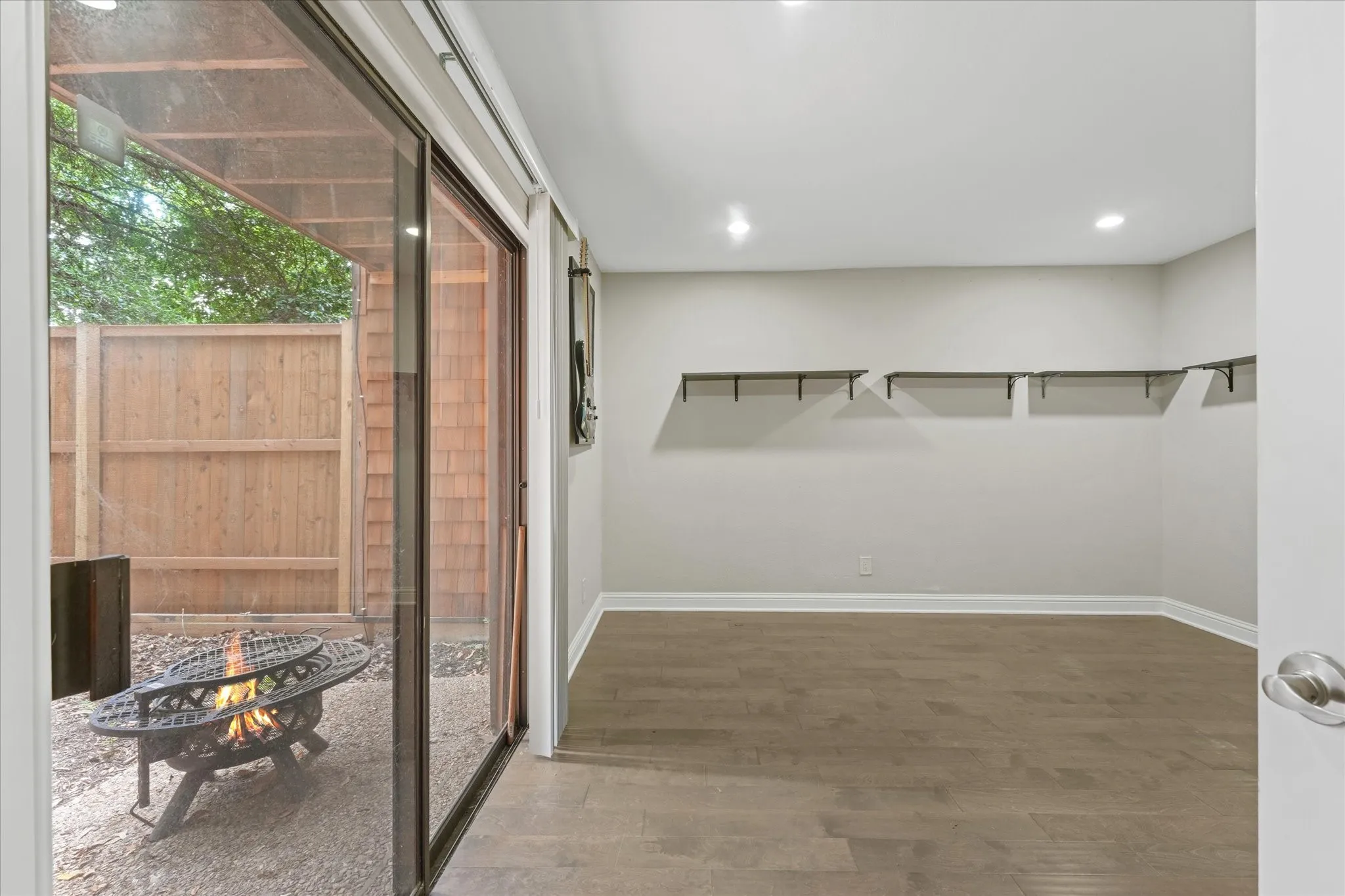 bedroom on first floor with patio access