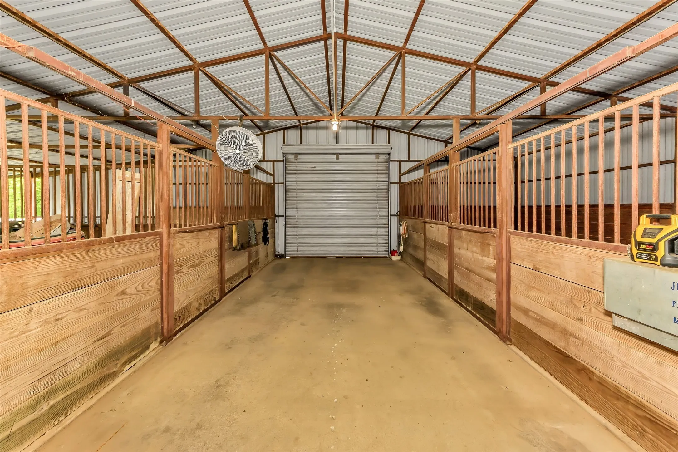 Stalls with runs and concrete walkway