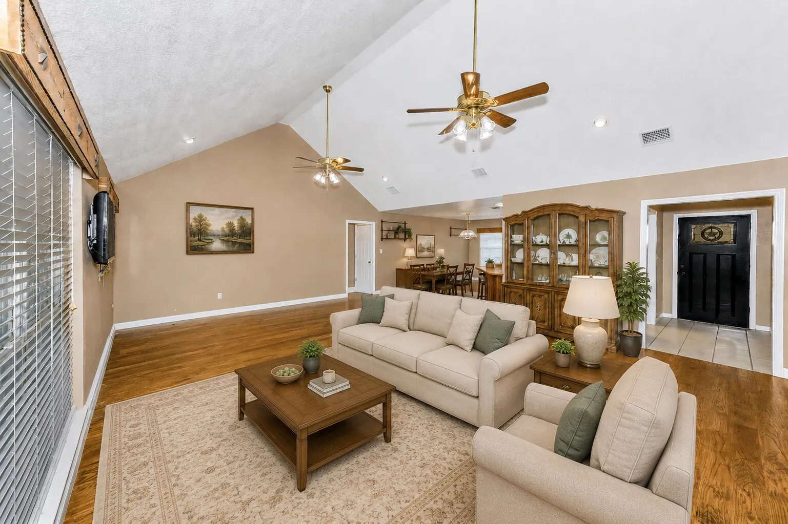 Virtually stage.  Vaulted ceilings. Hand-scraped wood floors.