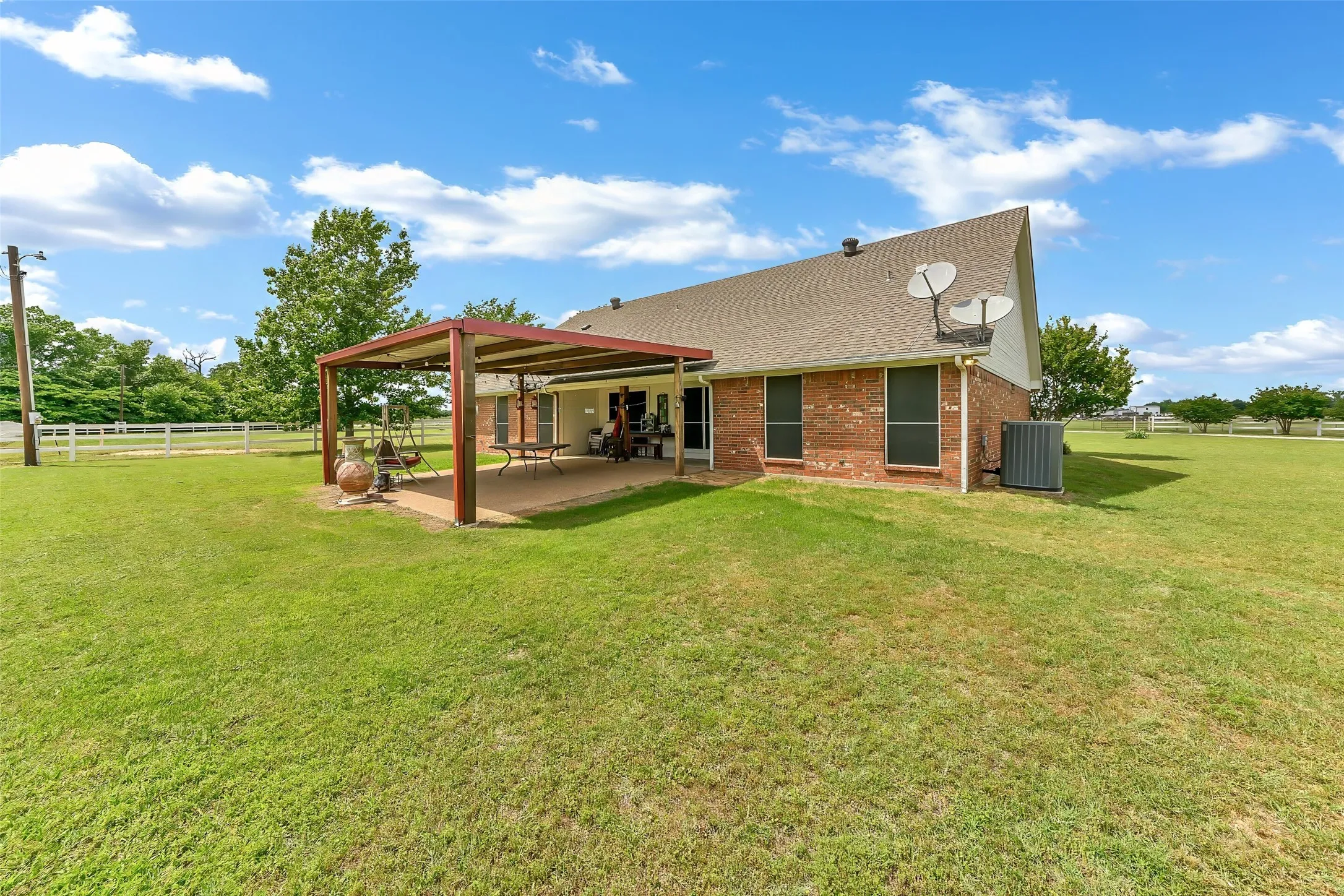 Brick exterior with covered patio.